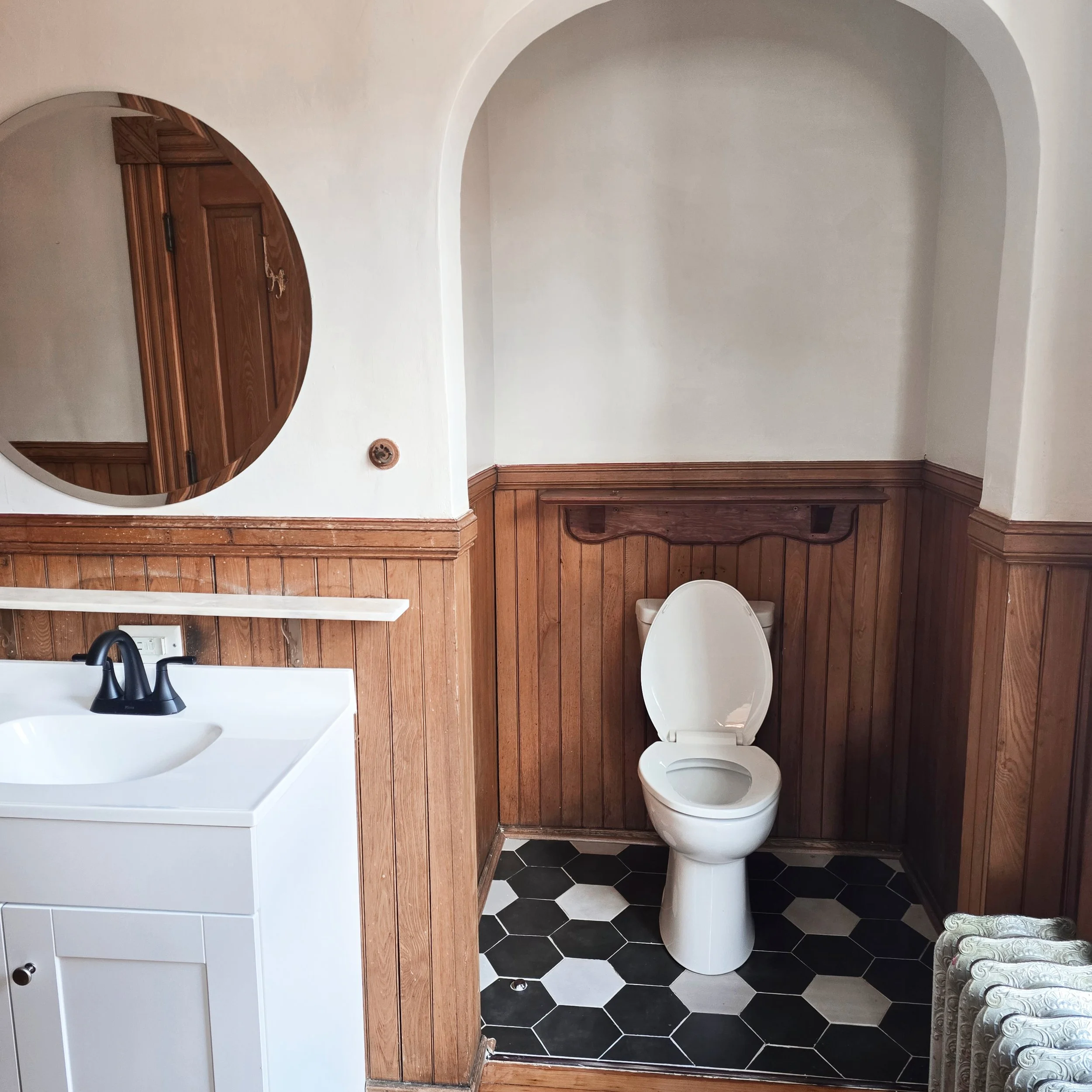 Professionally staged bathroom in a Hanover, PA home featuring clean finishes, fresh linens, and simple styling to create a welcoming first impression.