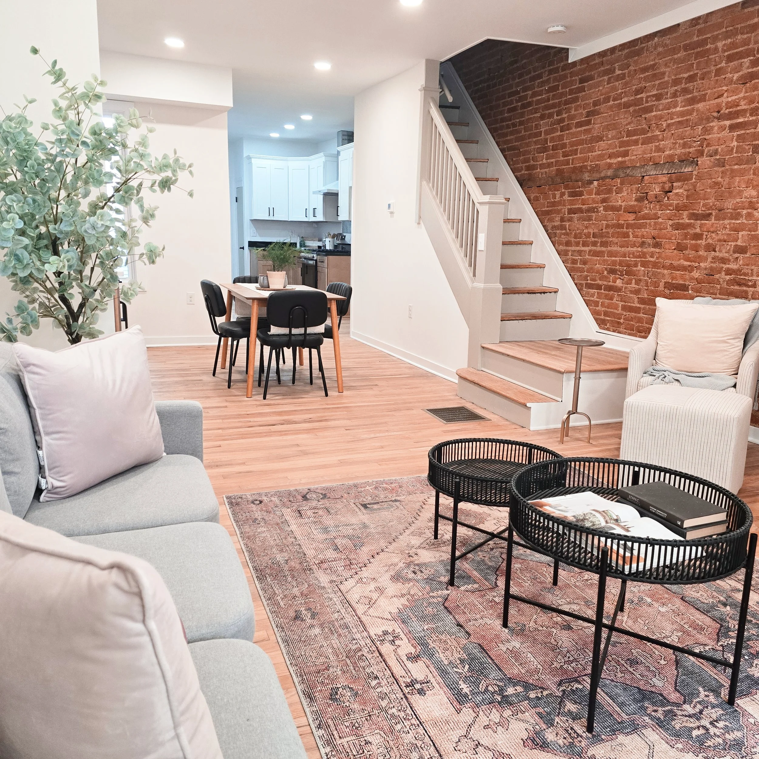 Professionally staged open-concept living and dining room in a Lancaster, PA home featuring coordinated furnishings, neutral décor, and a bright, welcoming layout.