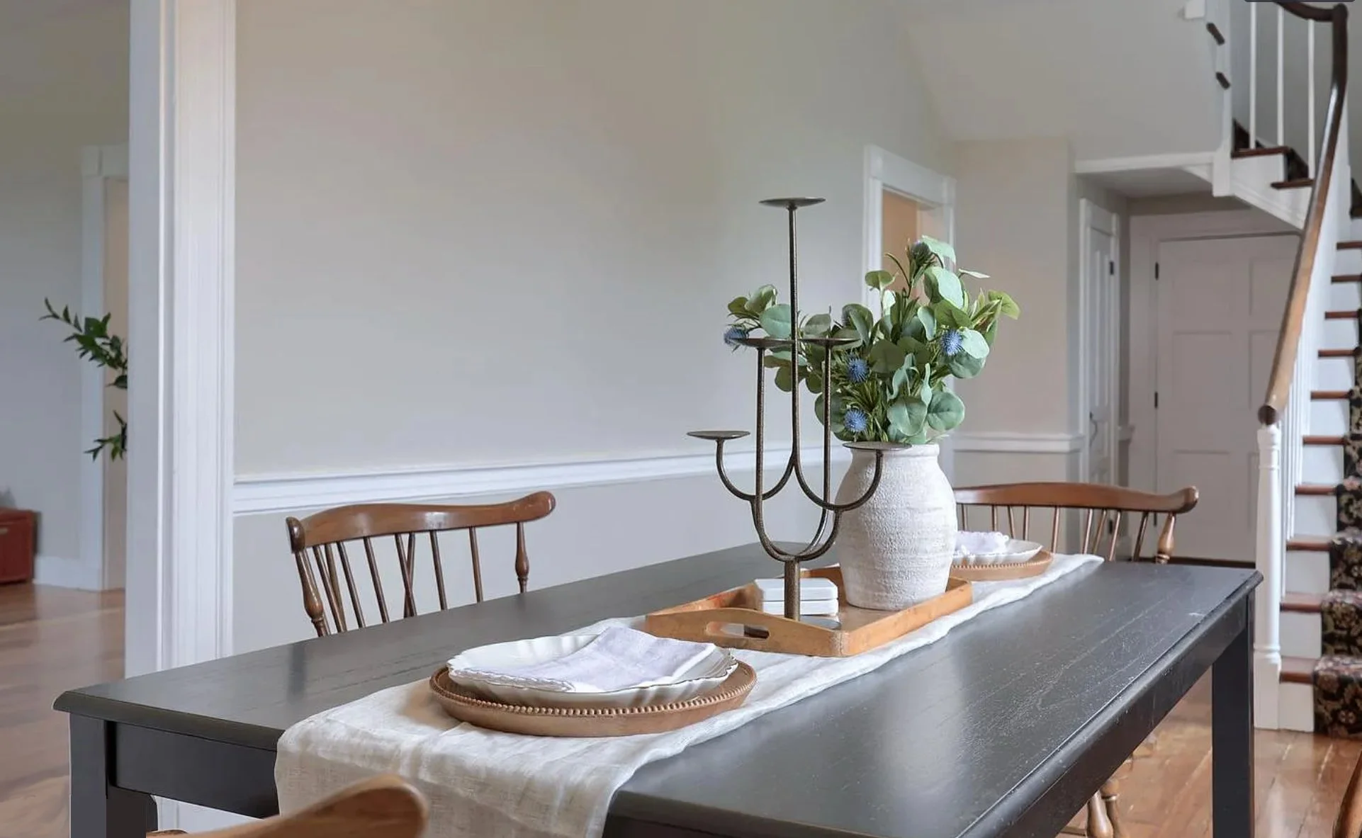 Close-up of a styled dining table featuring decorative accessories, greenery, and natural textures in a professionally staged Columbia, PA home.