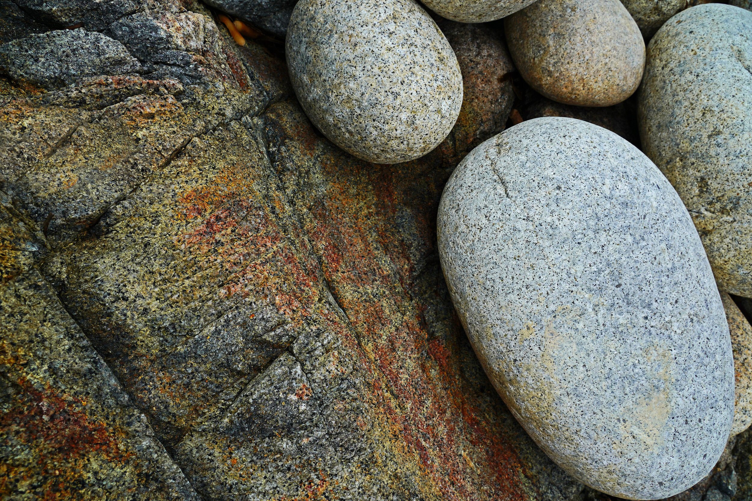 I came across this image on the beach at Porth Nanven, Cornwall. It was the contrast between the straight Lineal rocks and the round smooth pepples together with the beautiful colours that caught my eye.