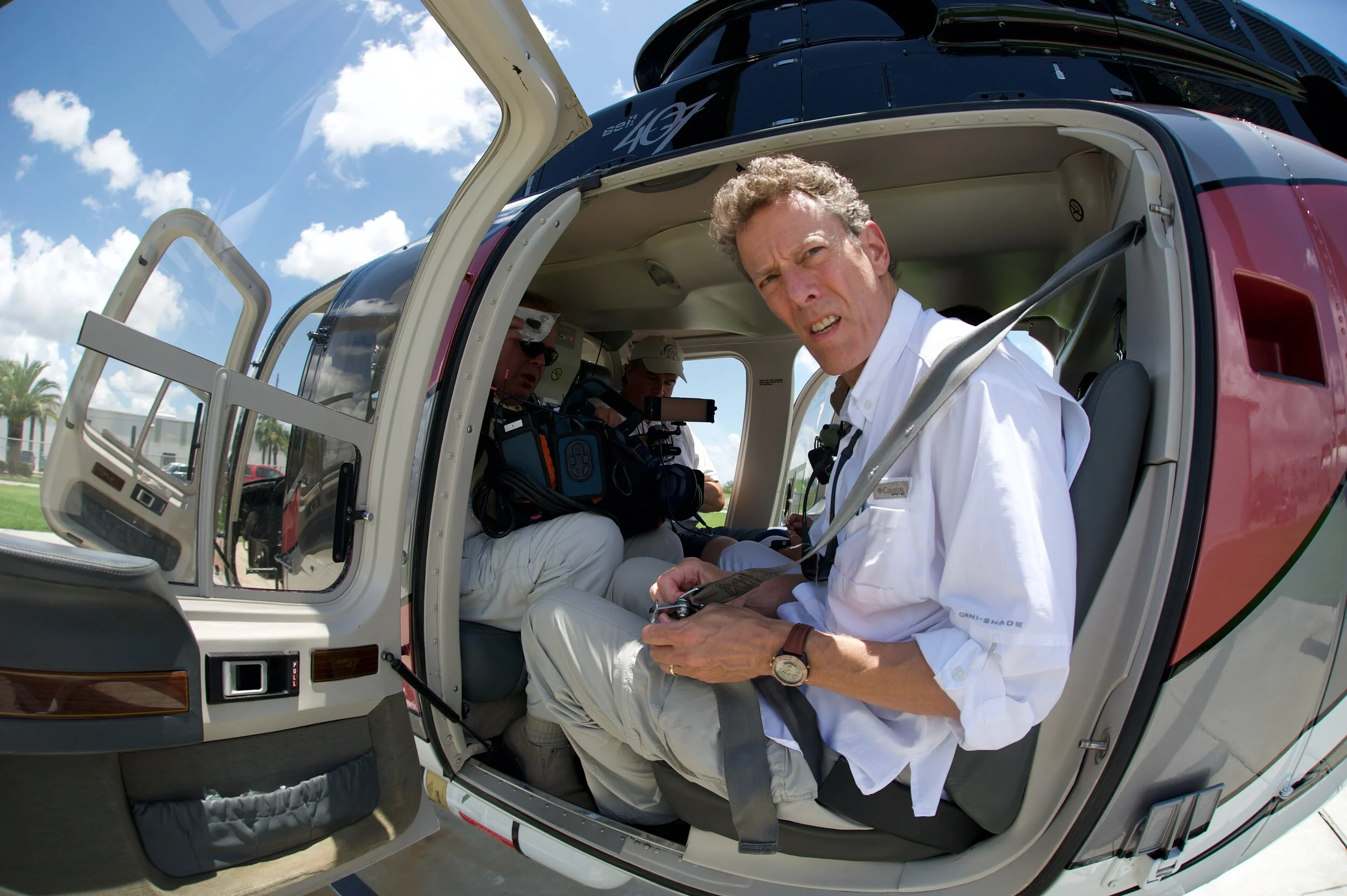 Bill Chamides buckles up for the flight to Grand Isle.