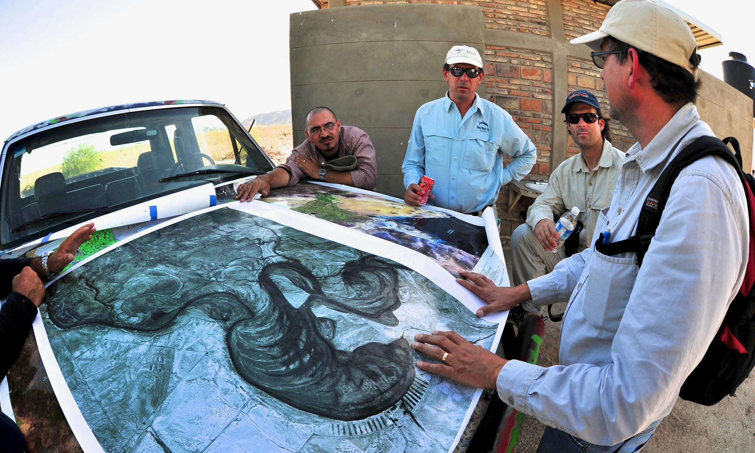 Sonoran Institute team discussing restoration plans for the Colorado River Delta