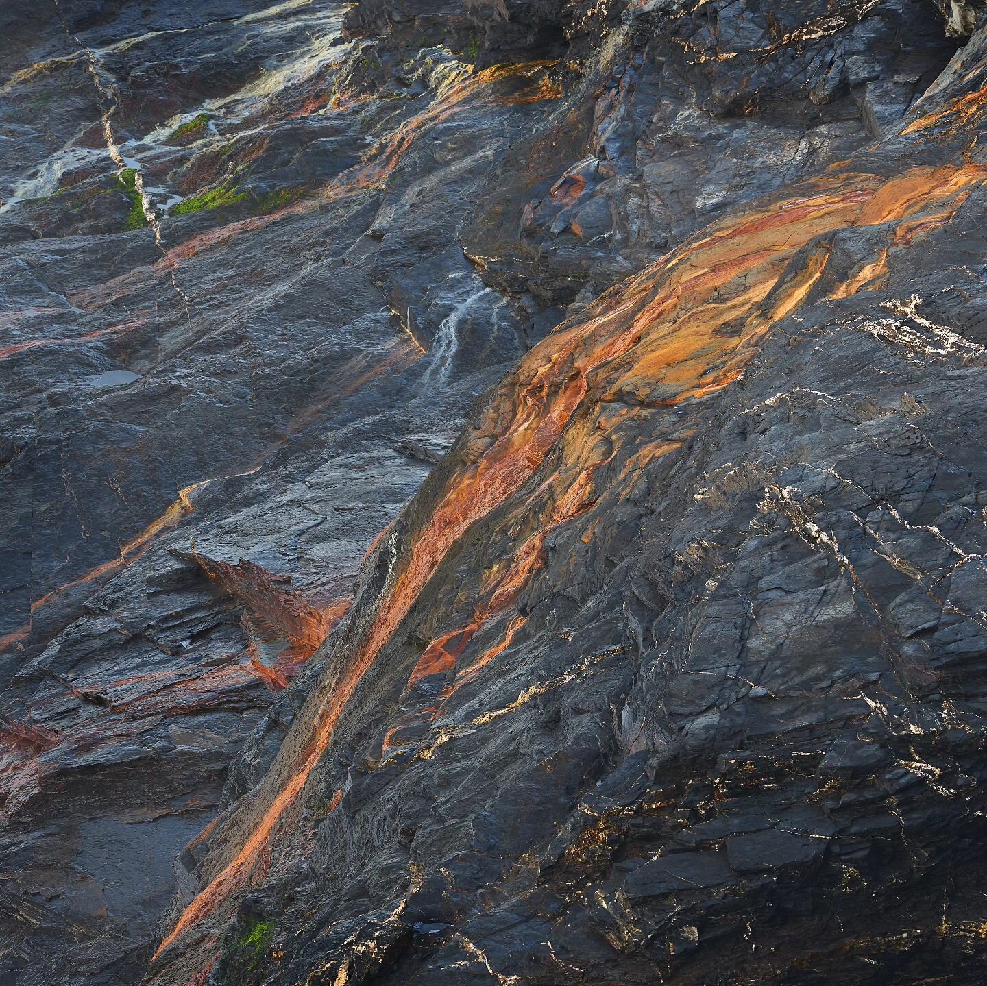Streams of Sanguine
Flamboyant pigments criss-cross over the diverse landscape, glowing sanguine streams curve around the ancient lumps of rock while the pure cobalt waterfalls gracefully trickle over its carved edges. 

Sony A7ii &amp; 70-200mm