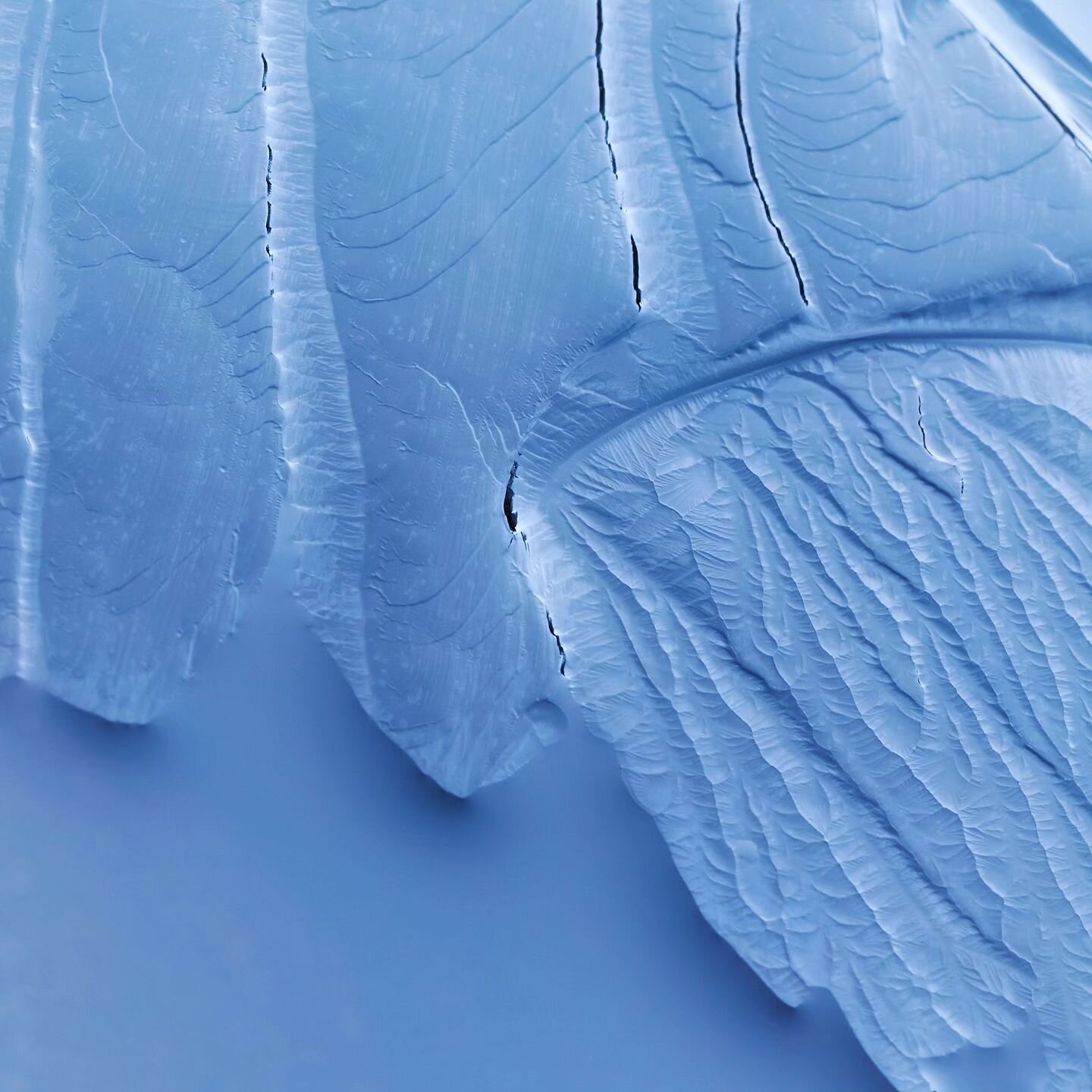 Azureous Abstraction 

An abundance of unqiue winter patterns and texture fill the scene. Abstraction comes into its own when there is no scale or context. What you make of this image is your own.