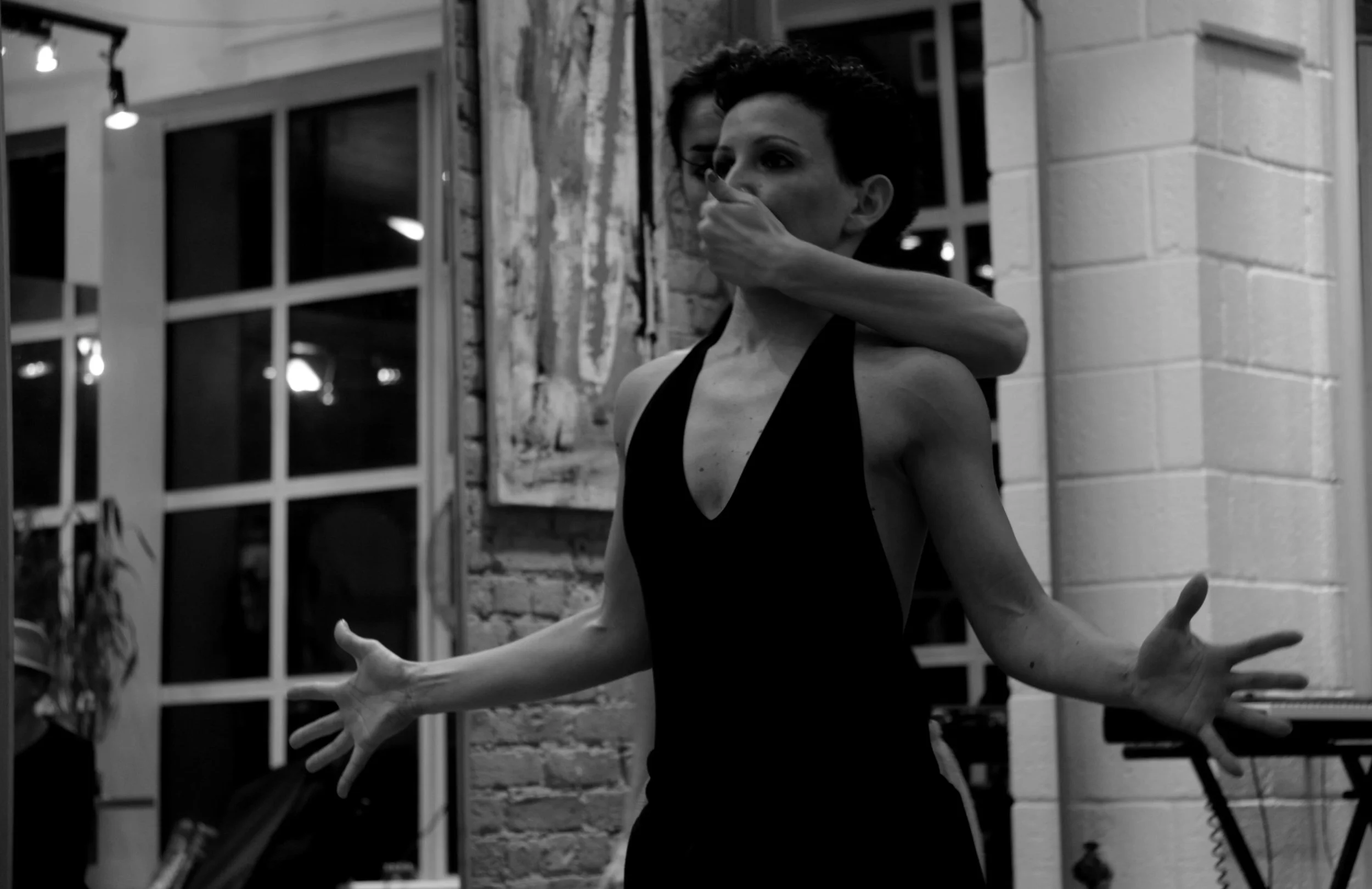 A black and white photo of Valentina Priolo and Gessica Paperini performing a duet as part of a site specific show.
