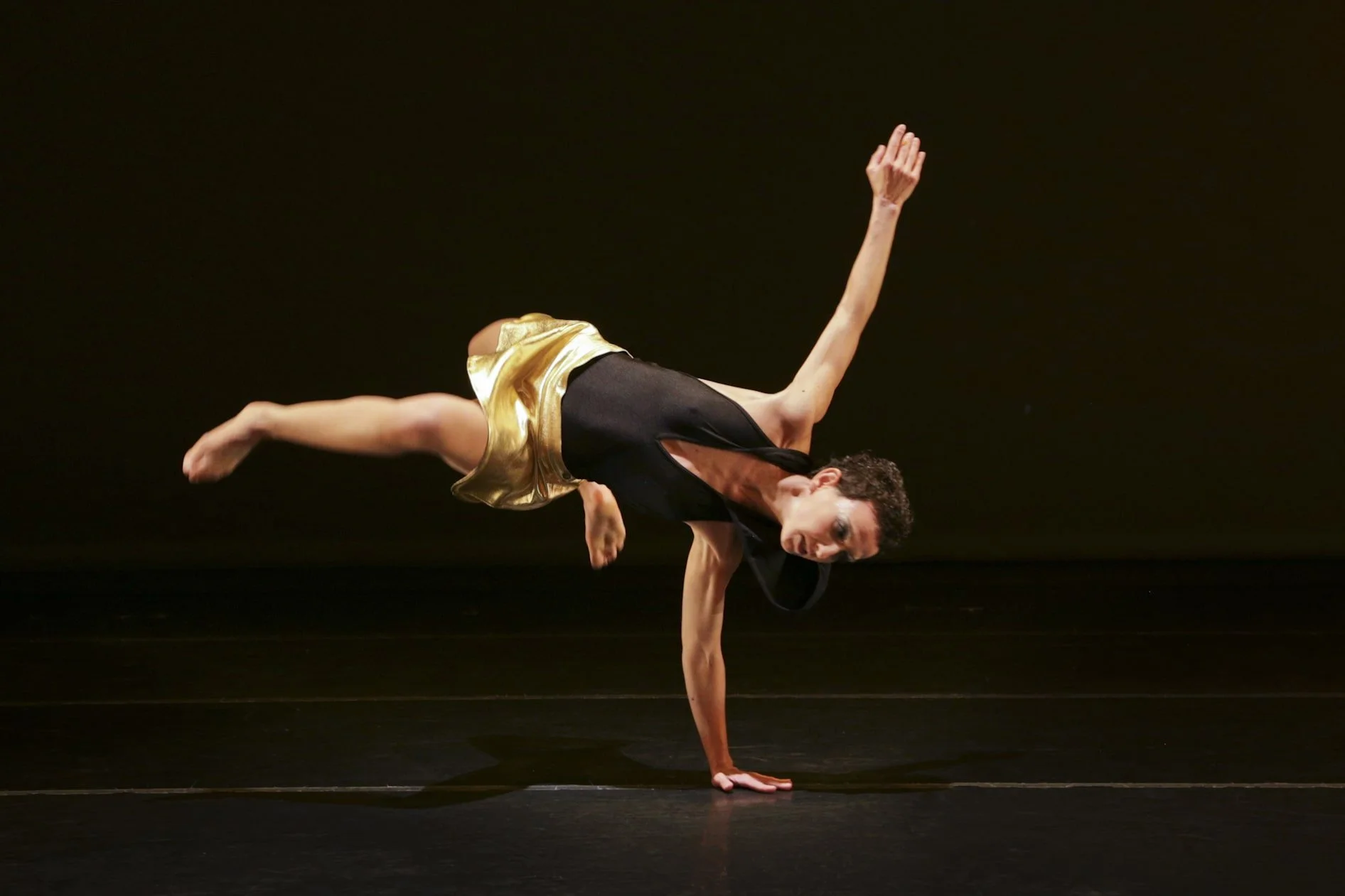 Valentina Priolo showcasing exquisite technique performs on stage for Overground Physical Theater dance company.