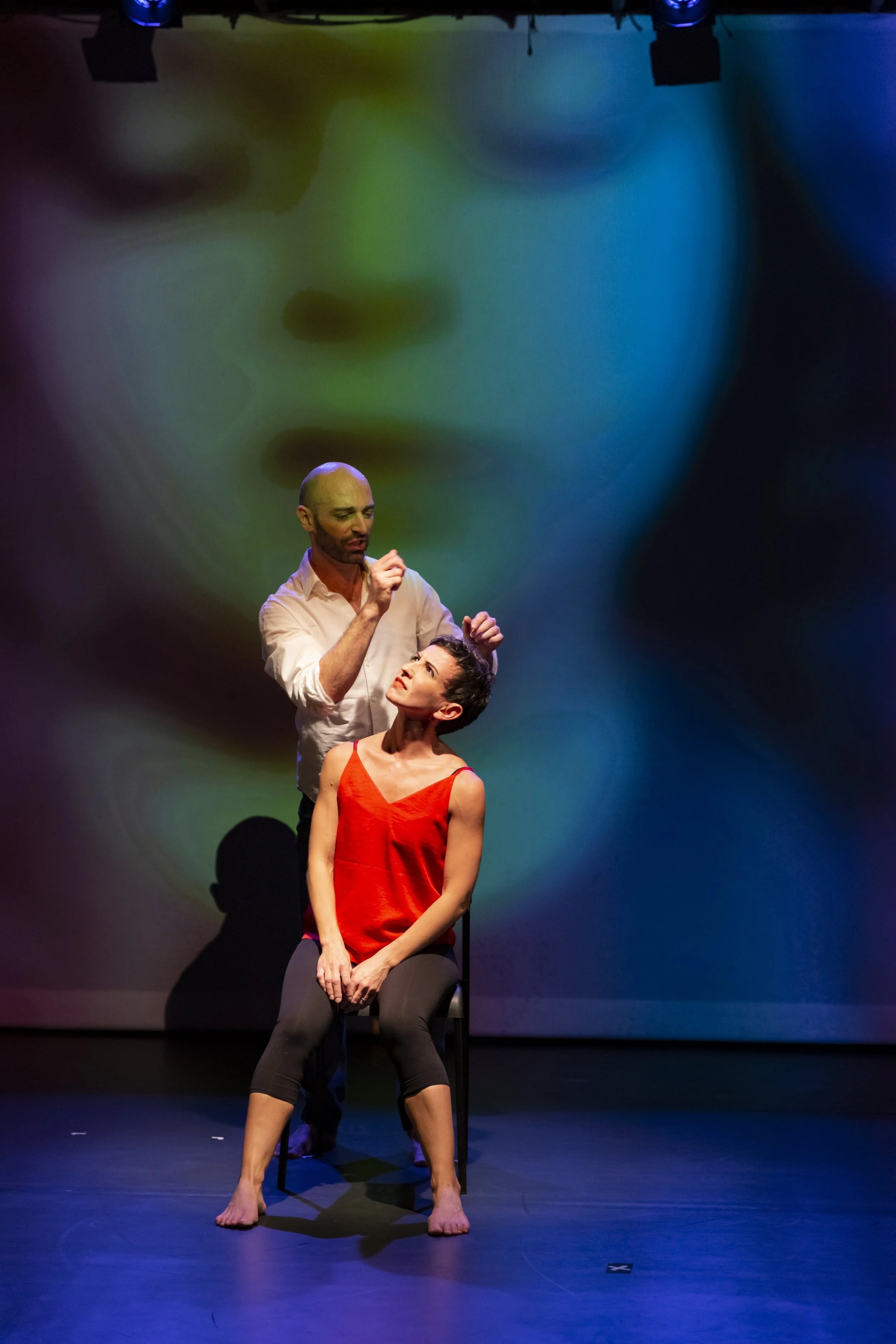 Richard Scandola gracefully holding Valentina Priolo's hair, adding an element of intrigue for a dance theater piece performed in New York City for Overground Physical Theater dance company.