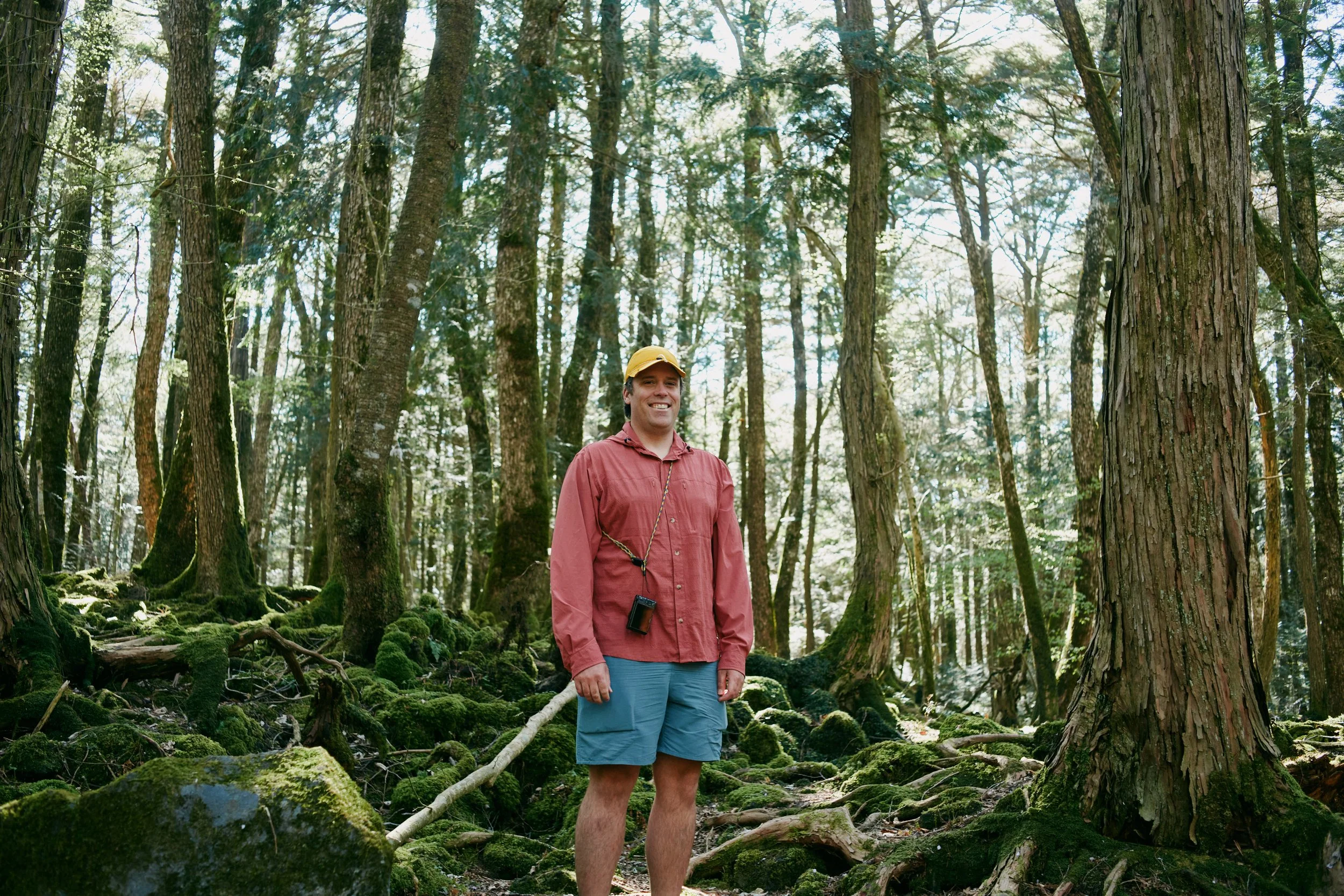 Parapack founder Ian wearing a mustard P-CAP and red Jolly Gear sun hoodie hiking in Japan near Narusawa