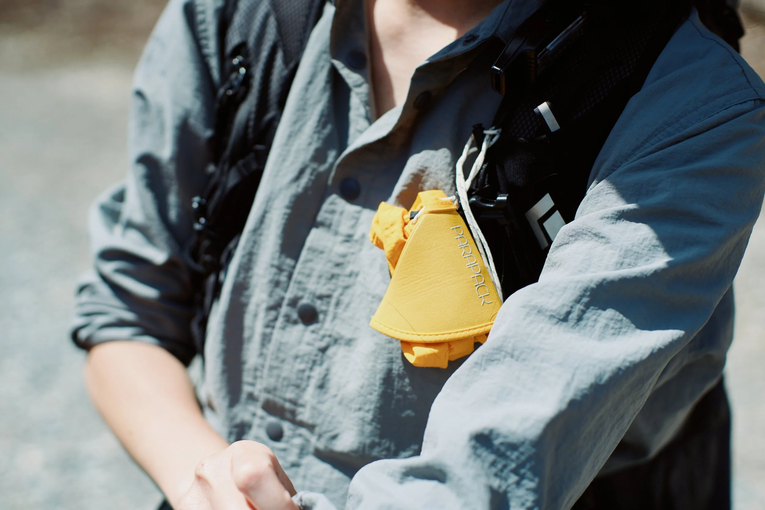 P-CAP Lite Mustard with customed reflective paracord in white, compact mode, drawing-string style sizing mechanism, multi-funk-tional headwear brand based in Pacifica, California, USA, photo by Hinano Kimoto 