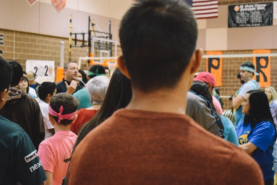 Students connecting through conversation during a shared school experience.