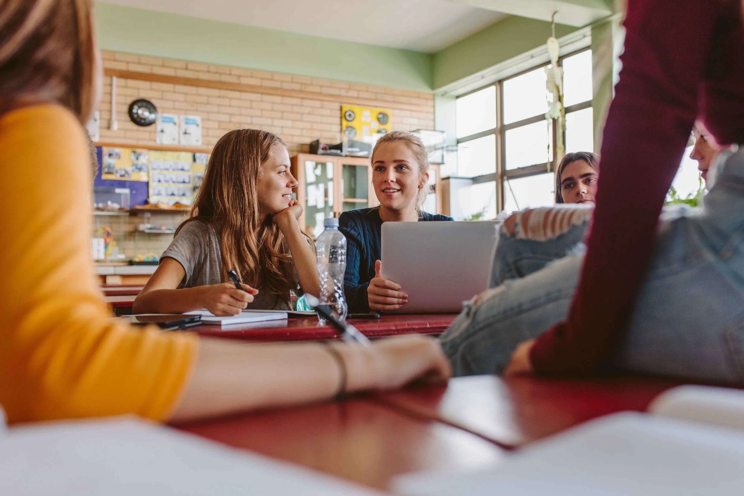 Middle school students working together during a Core Lessons classroom activity