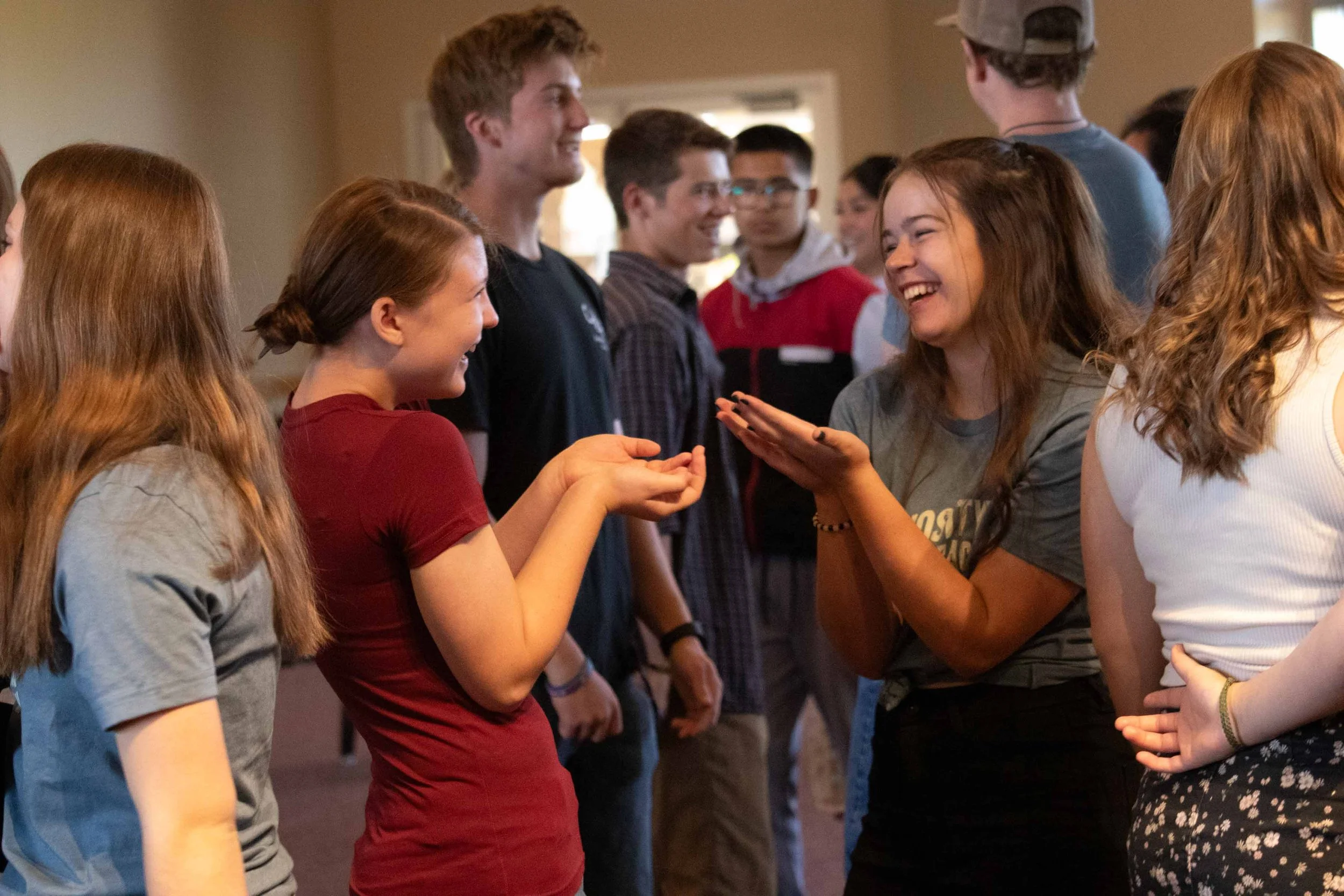Students laughing and interacting during a group experience