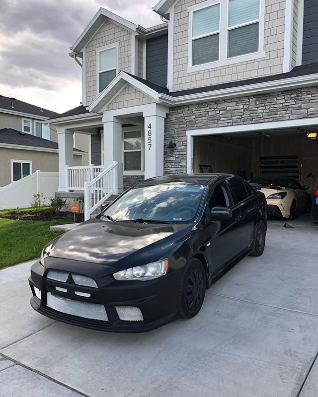 Full wrap on @funkboii_ evo lancer 😎 gloss metallic black hyper pearl 🙌🏾 Dm for business inquires 
#fombanation #cars #carsofinsta #drift #tints #lighttints #wraps #viny #vinylwraps #drift #carlifestyle #dreamcar #lowlife #lowered #rims #becausera