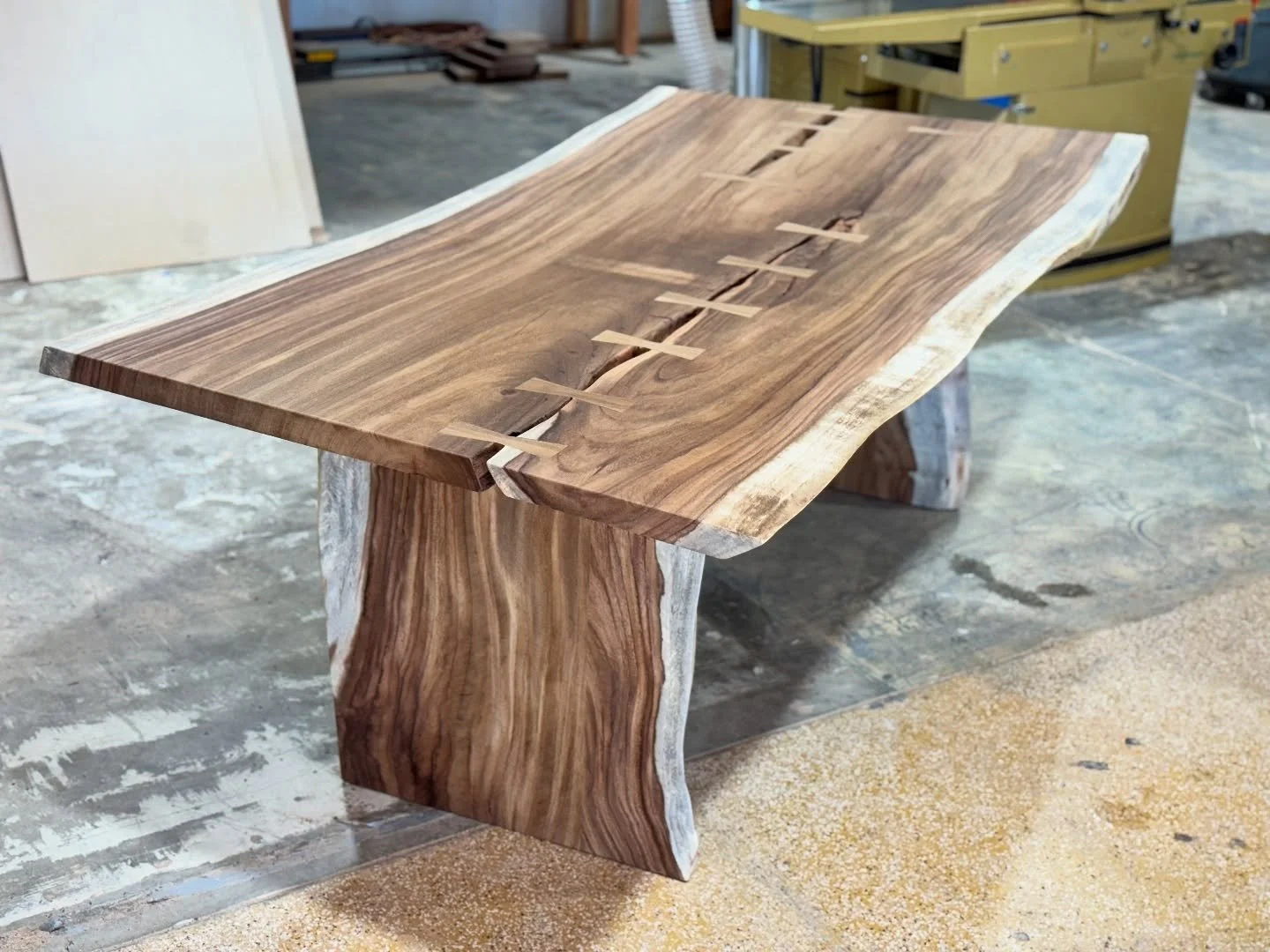 Monkeypod dining table.
Made with a single slab! 84x40&rdquo;x30&rdquo;
Featuring panel style legs.
The client wanted this piece to be as natural as possible while adding bow ties for strength. We added them to each end in the natural cracks and also