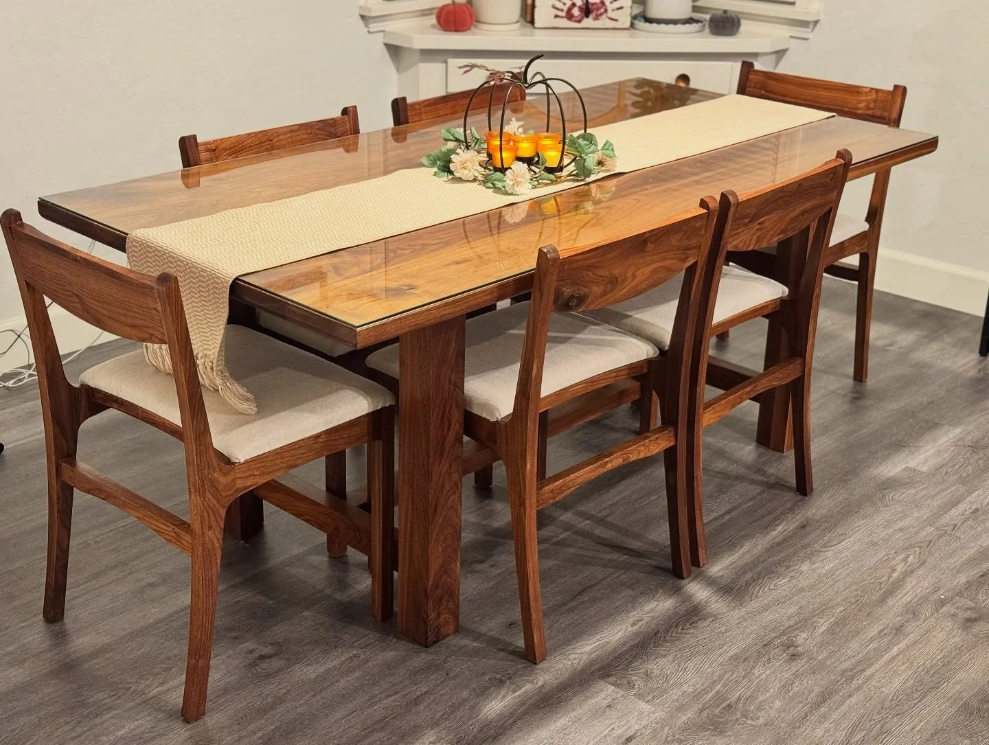 Some new photos of our ‘Capri’ dining table in solid Walnut.
Our clients added a piece of glass to this one for added protection! This table will last a lifetime. With little to no maintenance!
84x40”x30”
———