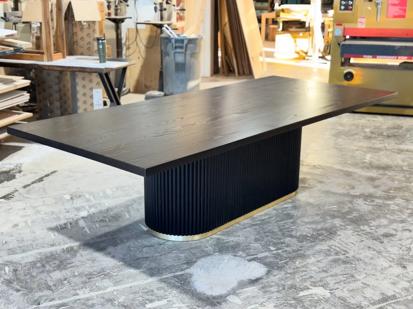 ⚫️ Latest piece! 
This is a version of our &lsquo;Monza fluted pedestal table. 
Rectangle tabletop and oval fluted base.
Featuring gold trim on the bottom of the base.
120x48&rdquo;x30 dimensions. Beauty!
Ebonized Finish in Satin.
&mdash;&mdash;&mdas