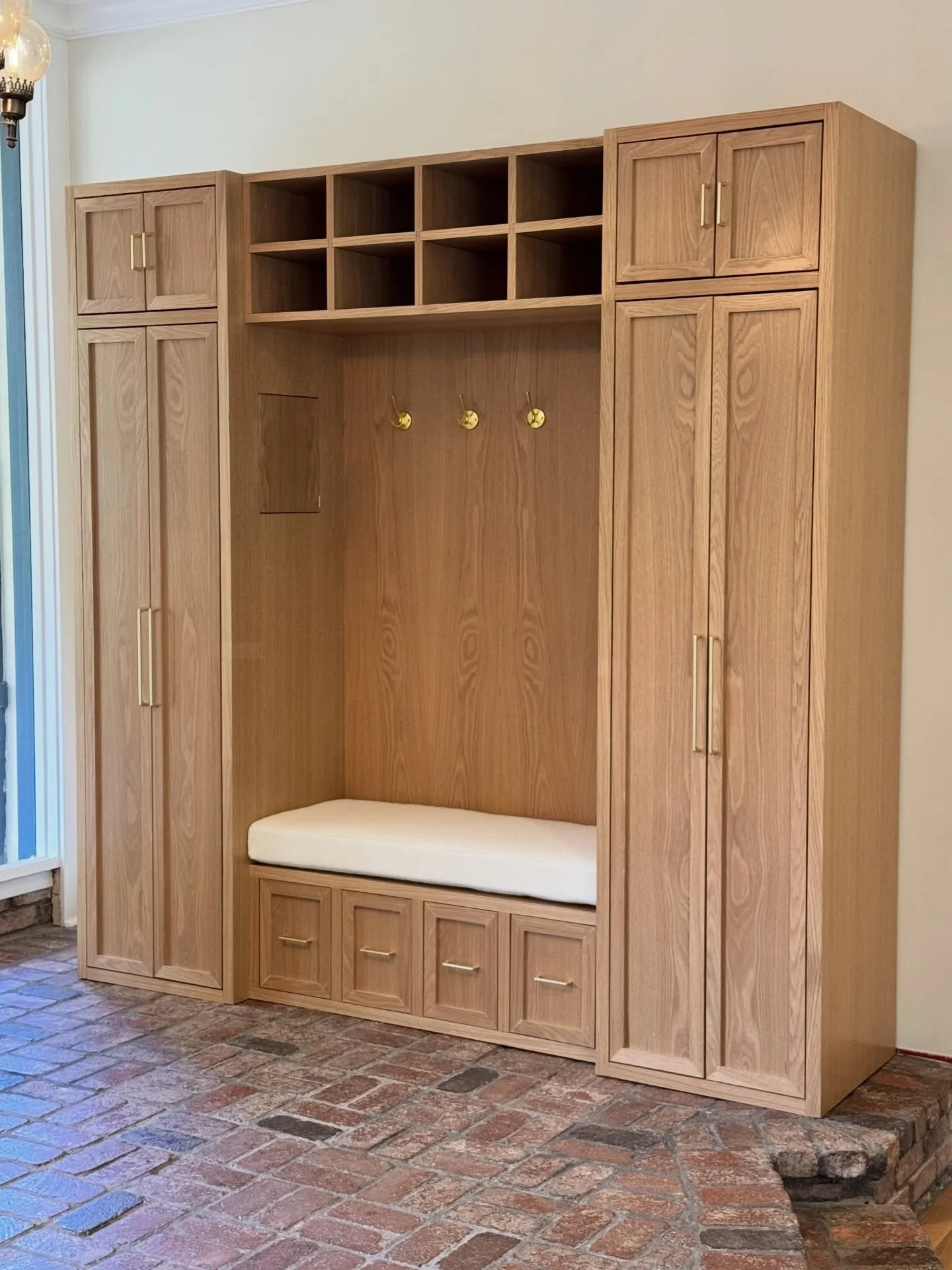 My favorite project of the year!
Oak entryway cabinet.
This was a challenging piece. Measuring in at 96x96&rdquo;x24&rdquo;
Featuring double coat storage cabinets on each side.
Drawers with cushioned bench seating on the bottom and open storage up to