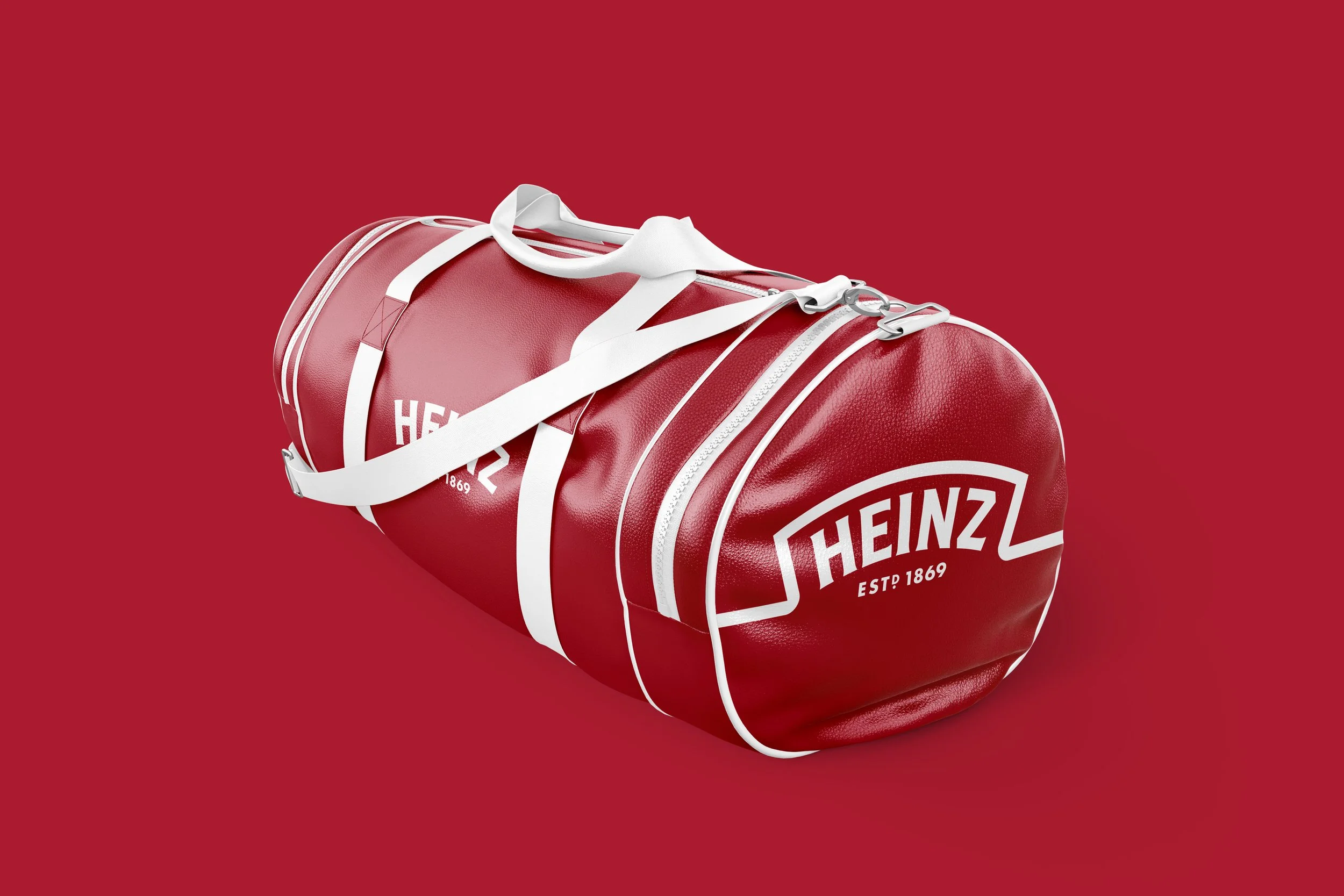 Red duffel bag with 'Heinz EST 1869' logo on maroon background.