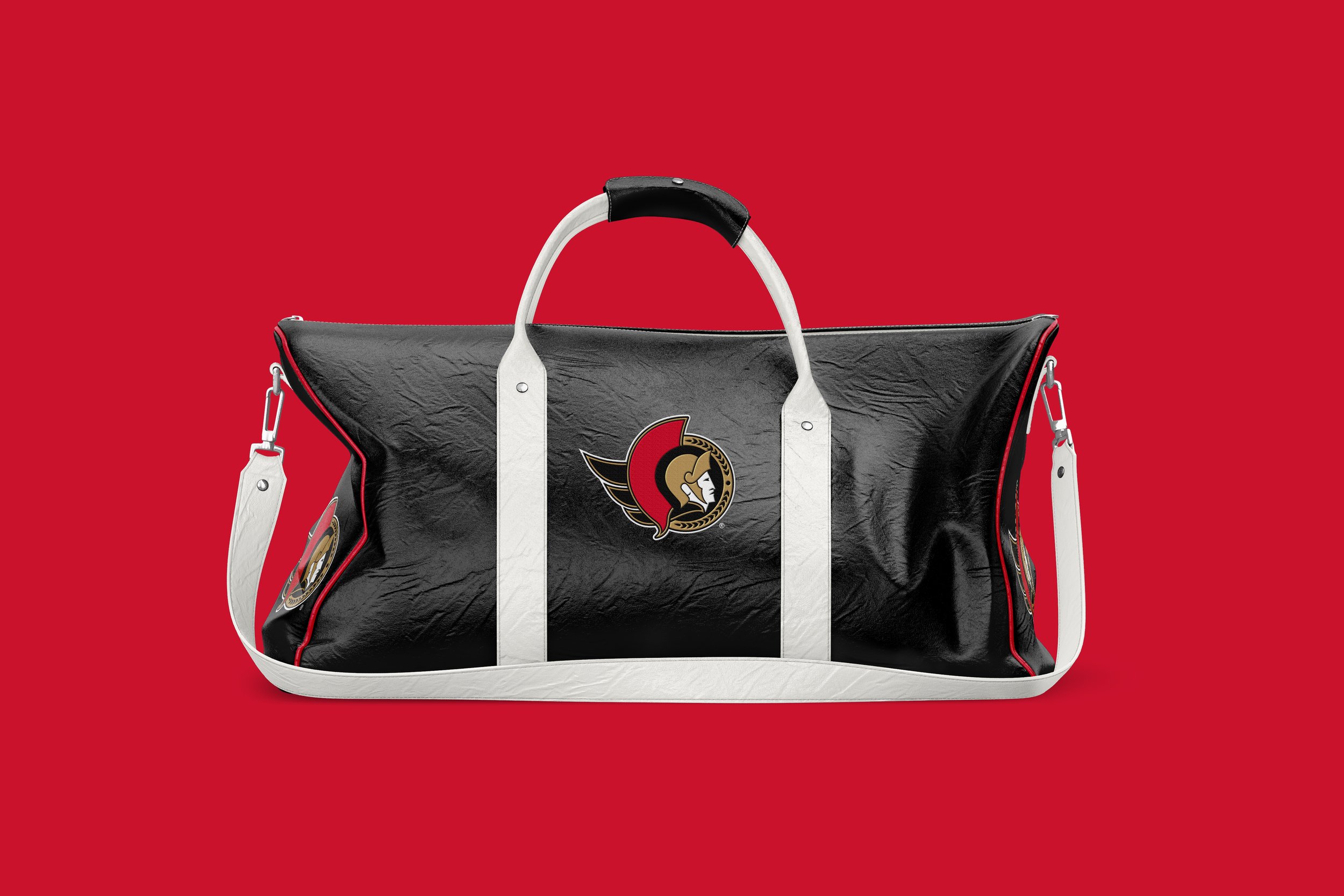 A black and white hockey bag with the Ottawa Senators logo on it, set against a plain red background.