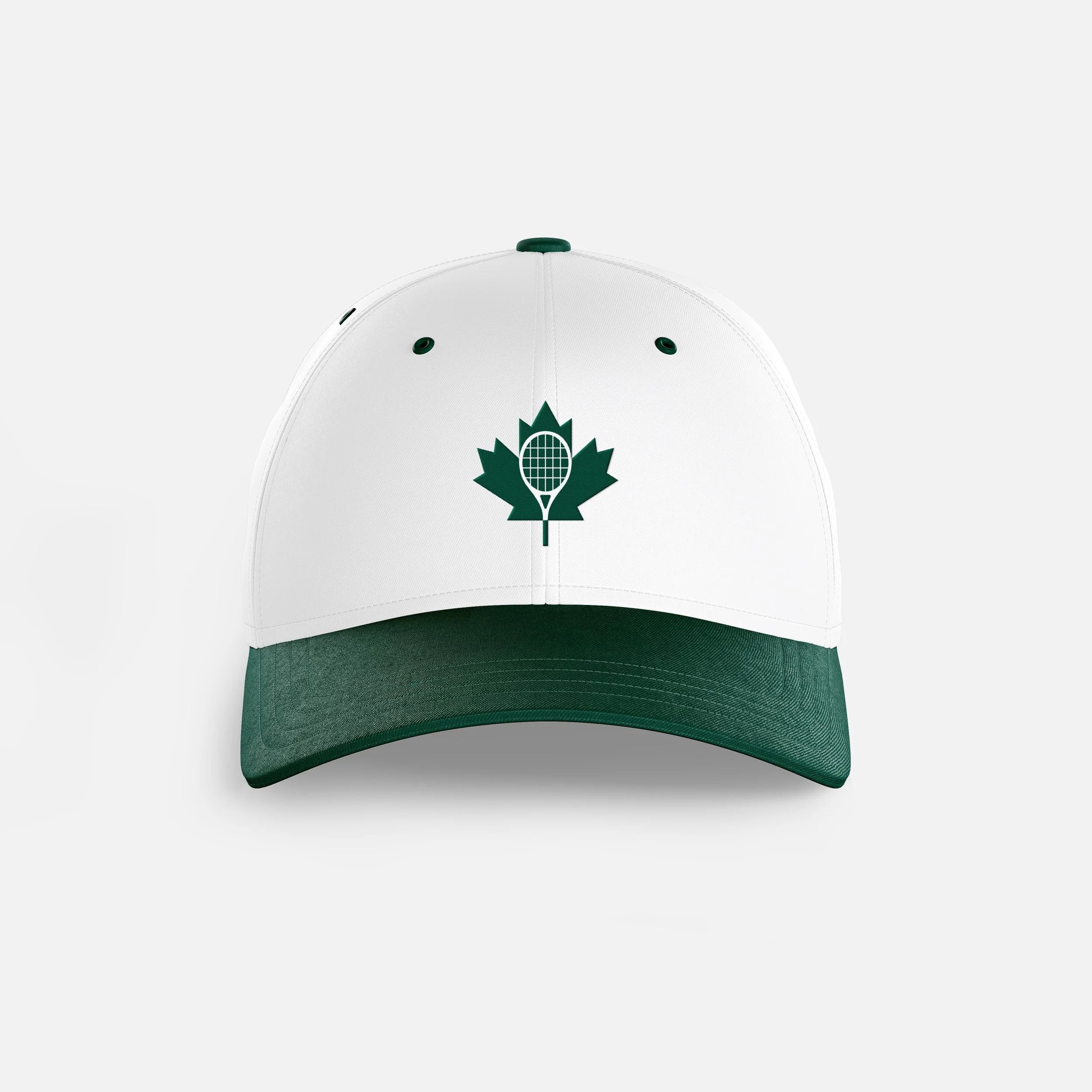 A white baseball cap with a green visor and a green maple leaf logo on the front.