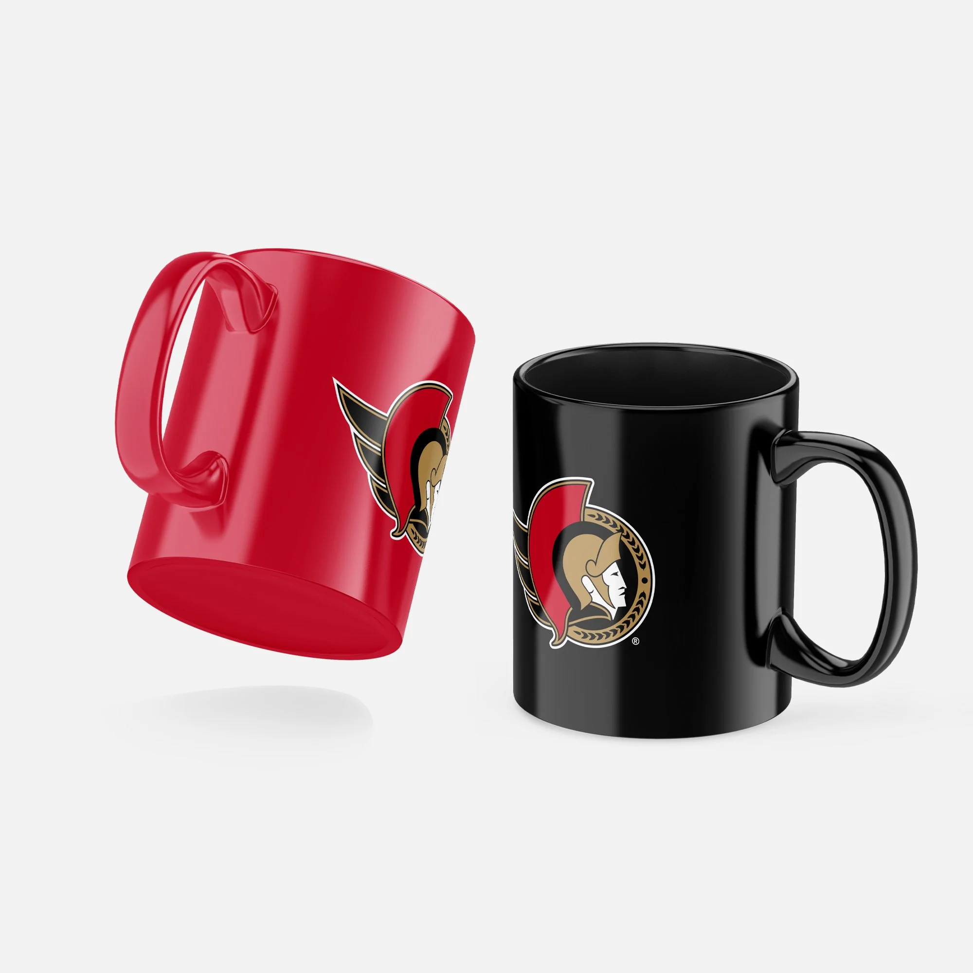 Two ceramic coffee mugs, one red with a football helmet logo, and one black with a matching logo, against a white background.
