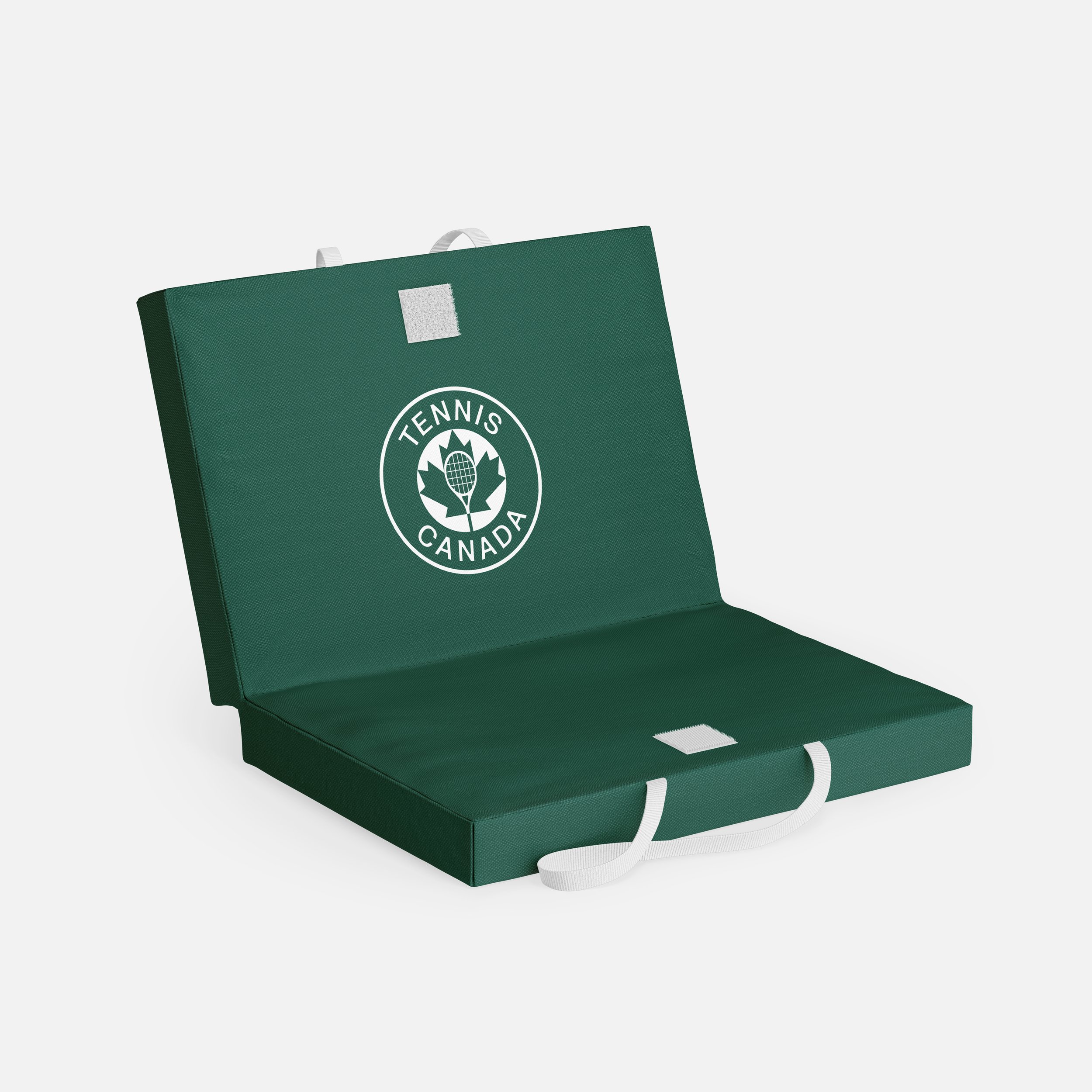 Green hockey training game with white laces and a circular logo that says 'Tennis Canada'.