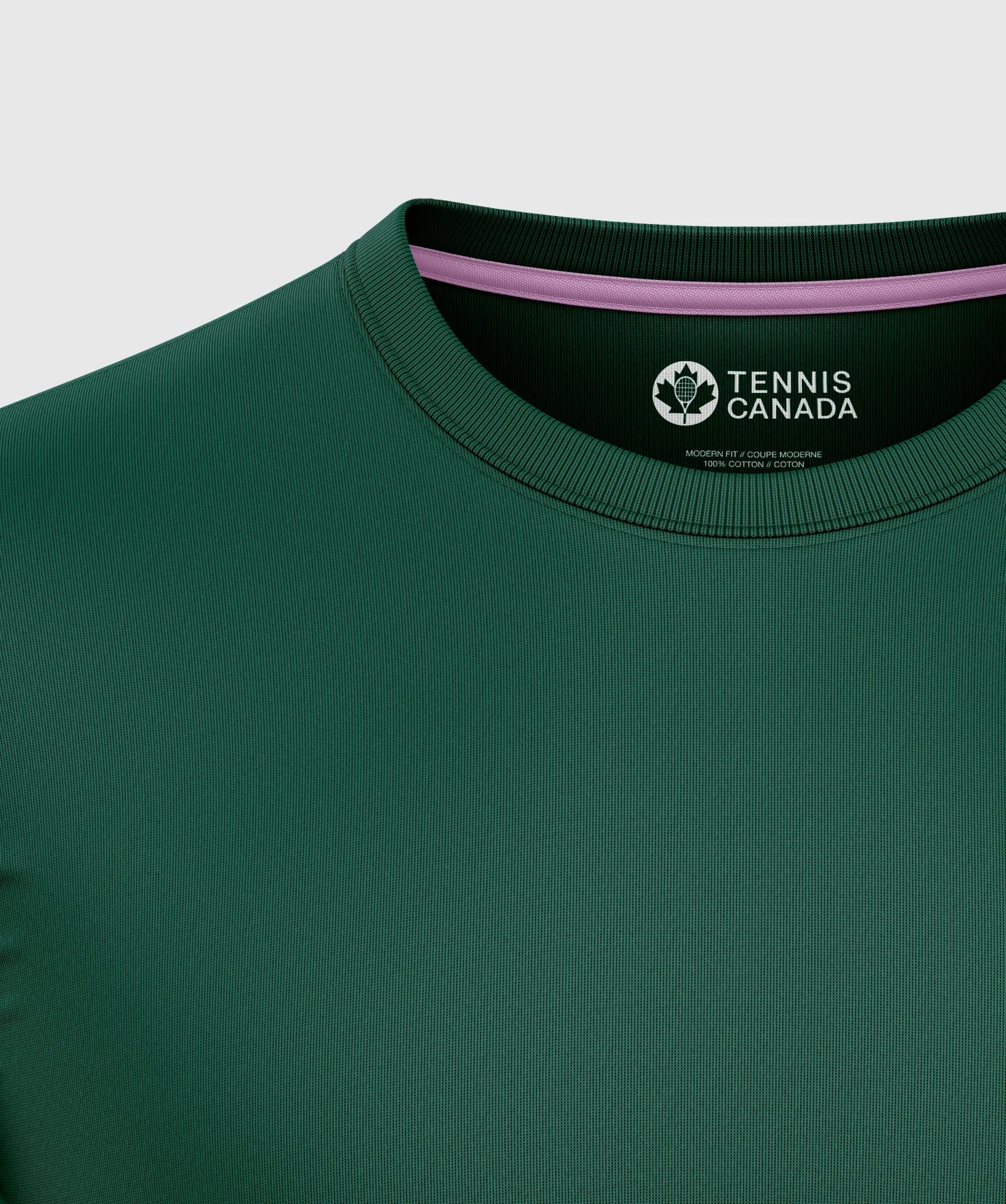 Close-up of a green tennis shirt with a collar, featuring the Tennis Canada logo inside the collar.