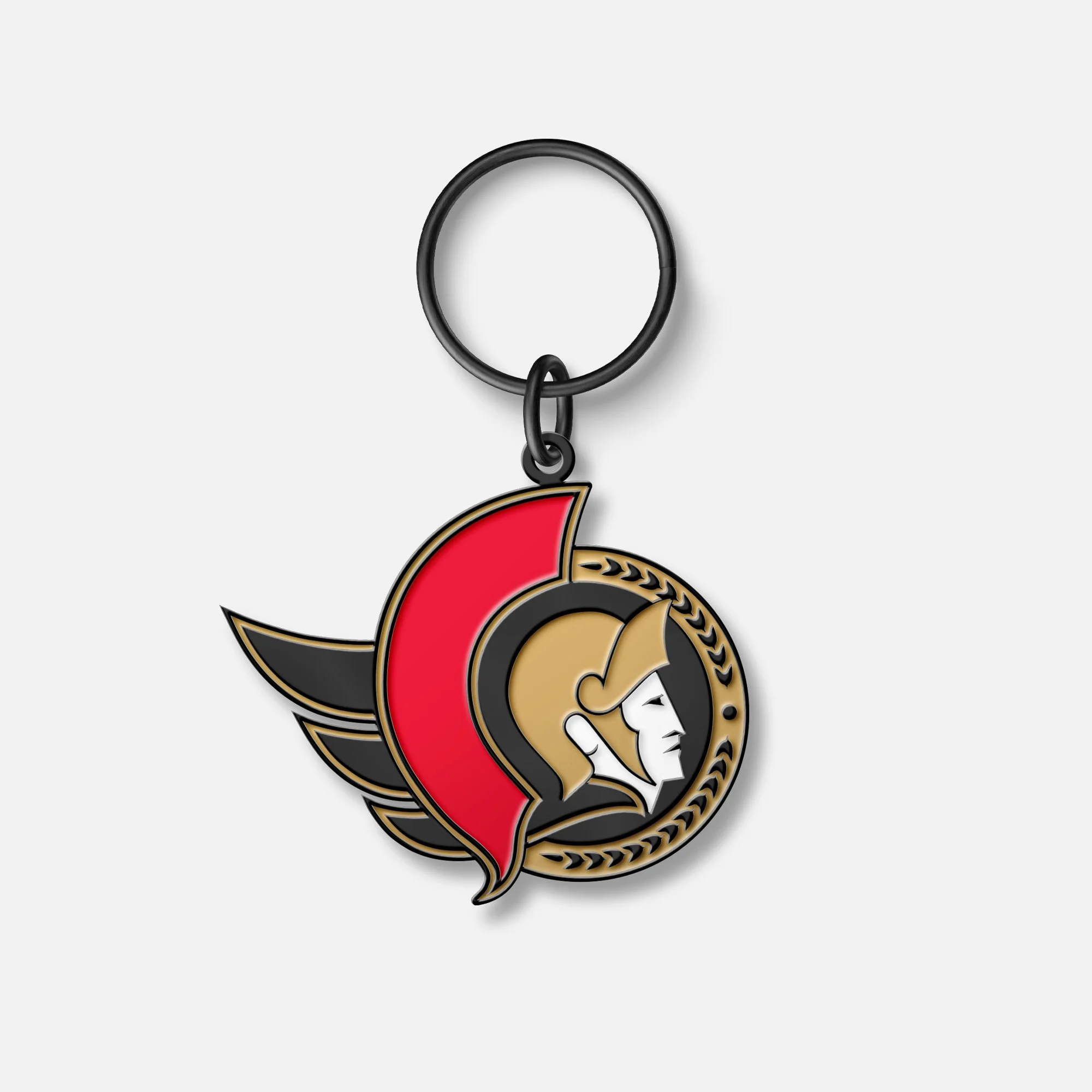 A keychain featuring the logo of the Ottawa Senators hockey team, with a stylized Roman senator head logo in black, gold, red, and white, attached to a black circular ring.