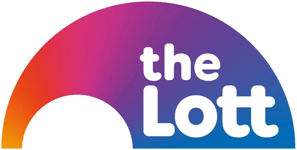 A colorful rainbow graphic with the text 'the Lott' written in white.