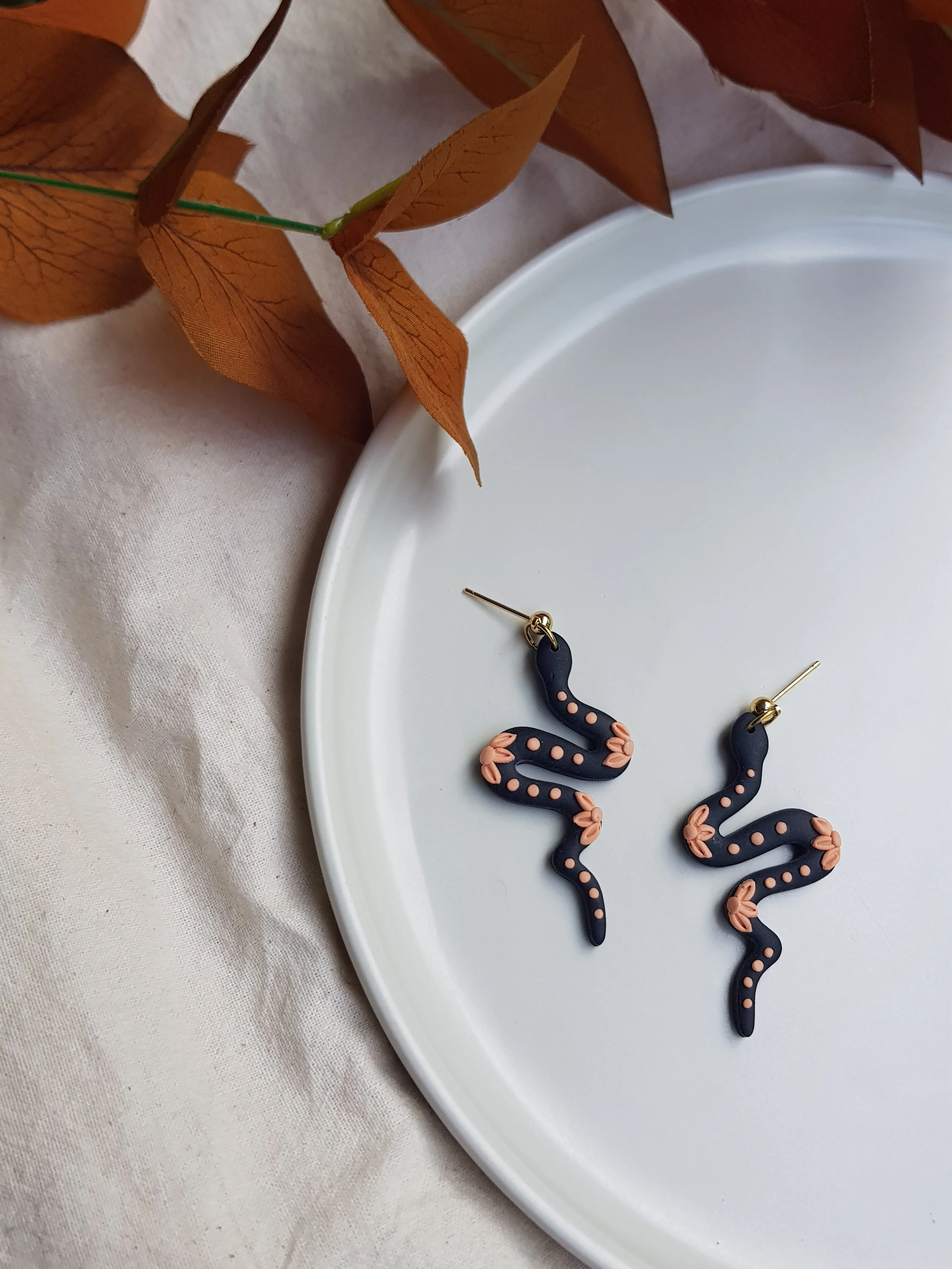 Clay Snake Dangles in "Peach Flowers at Midnight"
