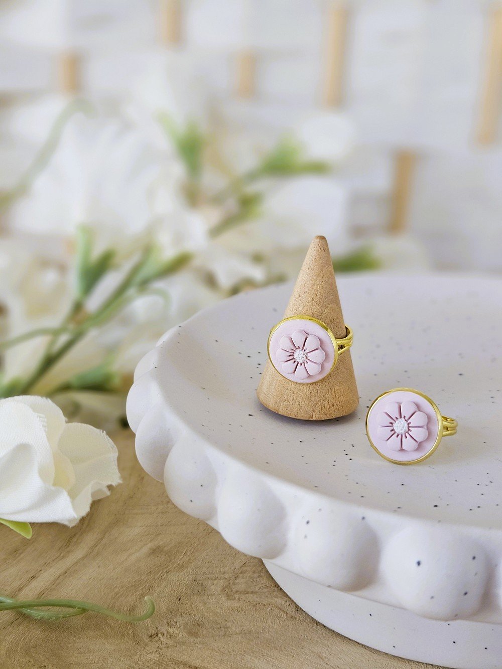 classic-blush-daisy-rings-gold-frame.jpg
