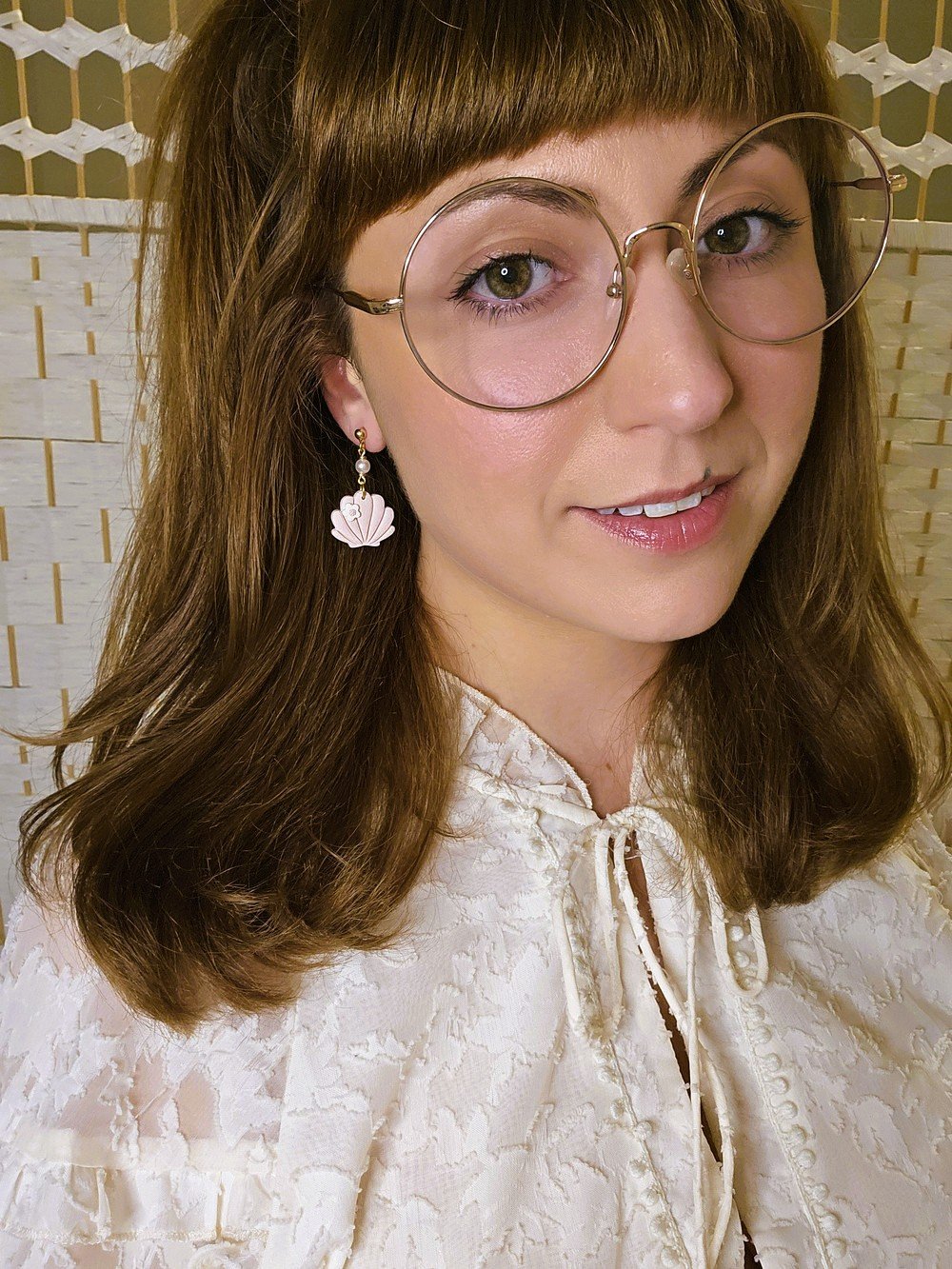 polymer-clay-earrings-shell-flower-dangle-blush-pink-on-model.jpg