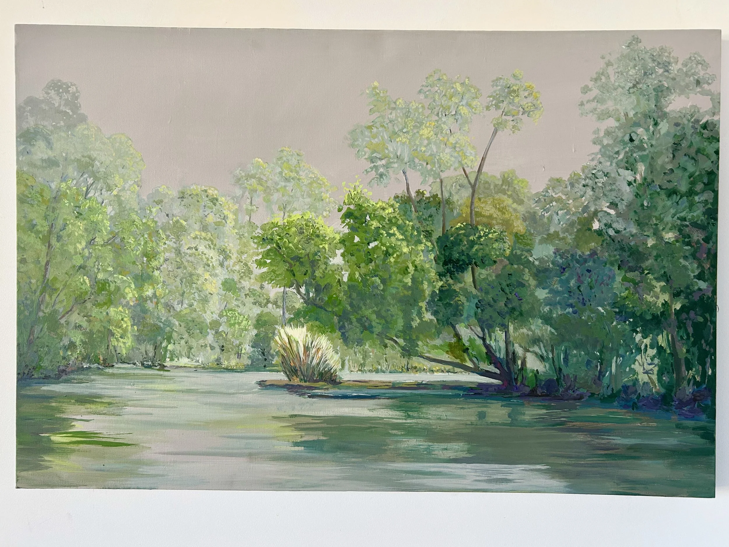 Work 257:  Green Trees on River Bank .  2025.   61 x 92 cms.