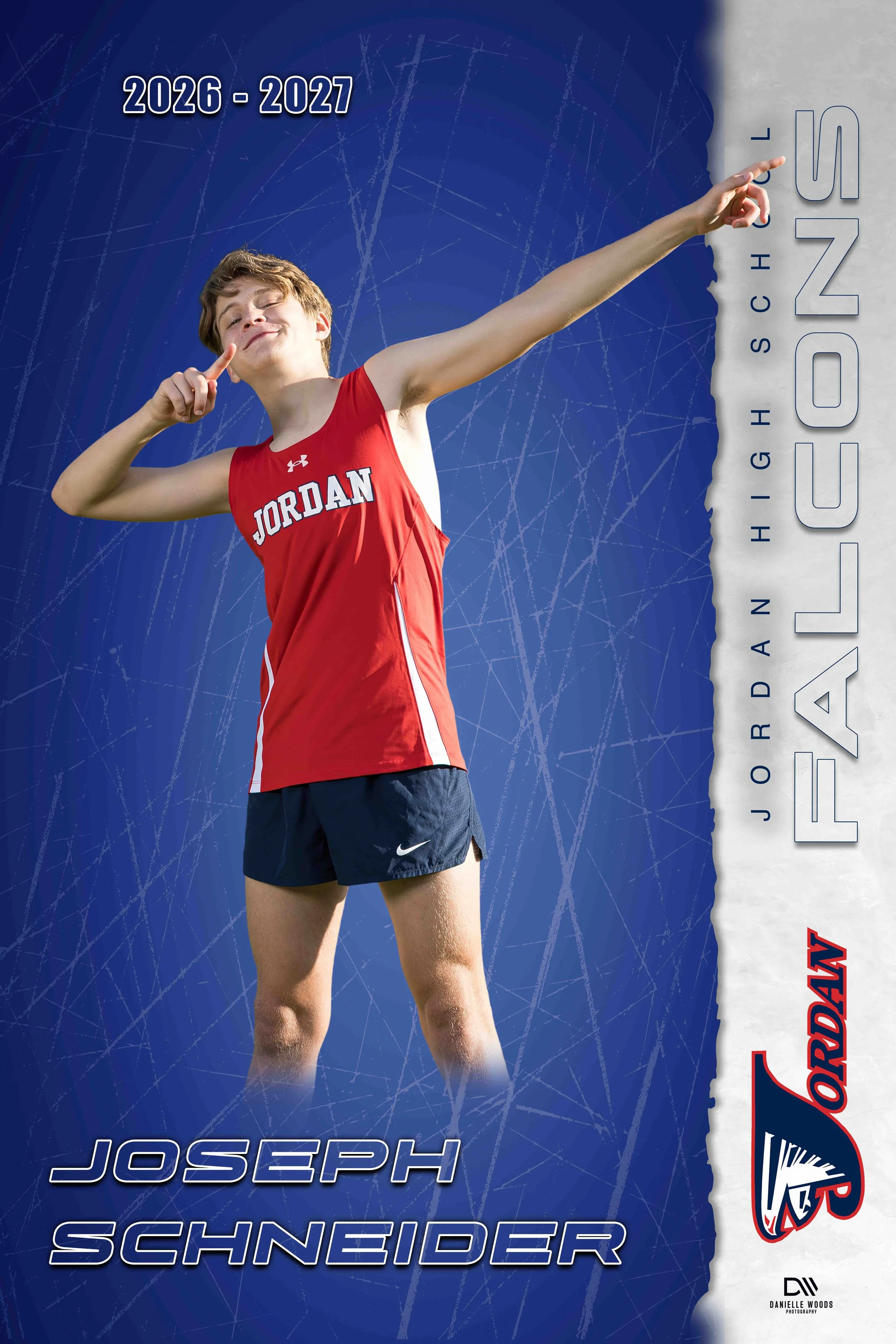 A young male athlete in a red Jordan sports uniform pointing upward with one arm, standing in front of a background with blue and white sections, text indicating the years 2026-2027, and the names Joseph Schneider and Danielle Woods Photography.
