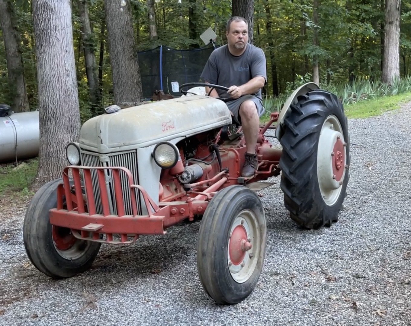 Brad on the 1946 Ford 2N tractor he rebuilt. (Not pictured: An ocean of hydraulic fluid spilled on his garage floor during the process.)