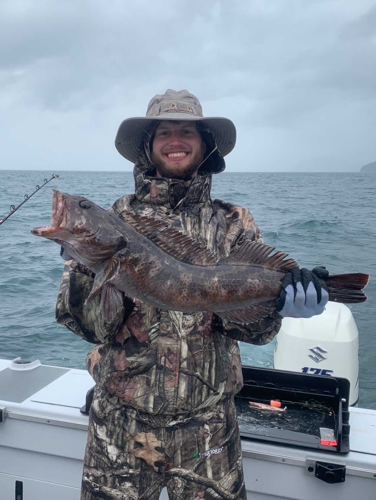 Cole with a lingcod, caught on a fishing trip to Alaska with his dad.