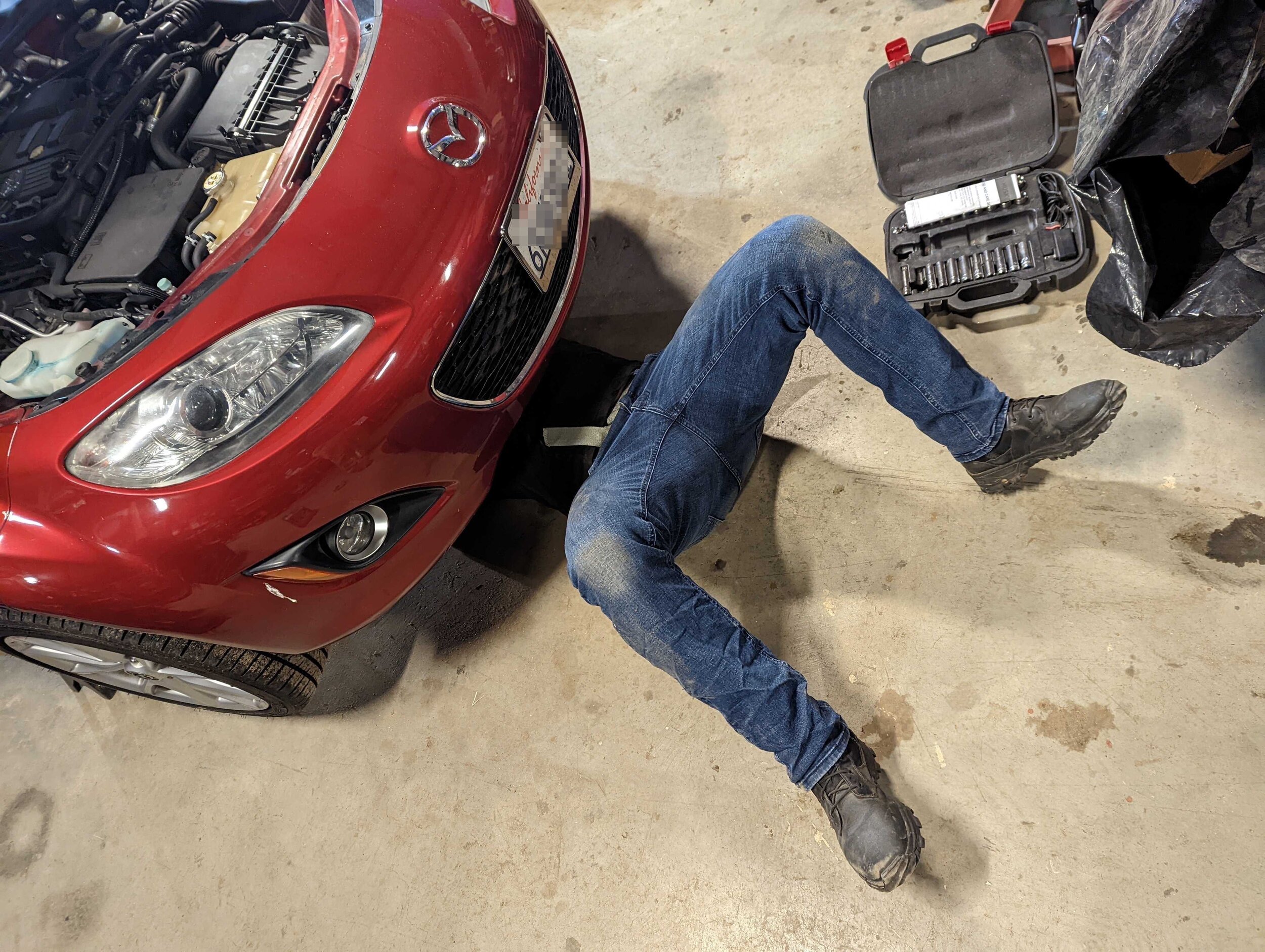 Fabian changing fluids in his 2010 Mazda Miata