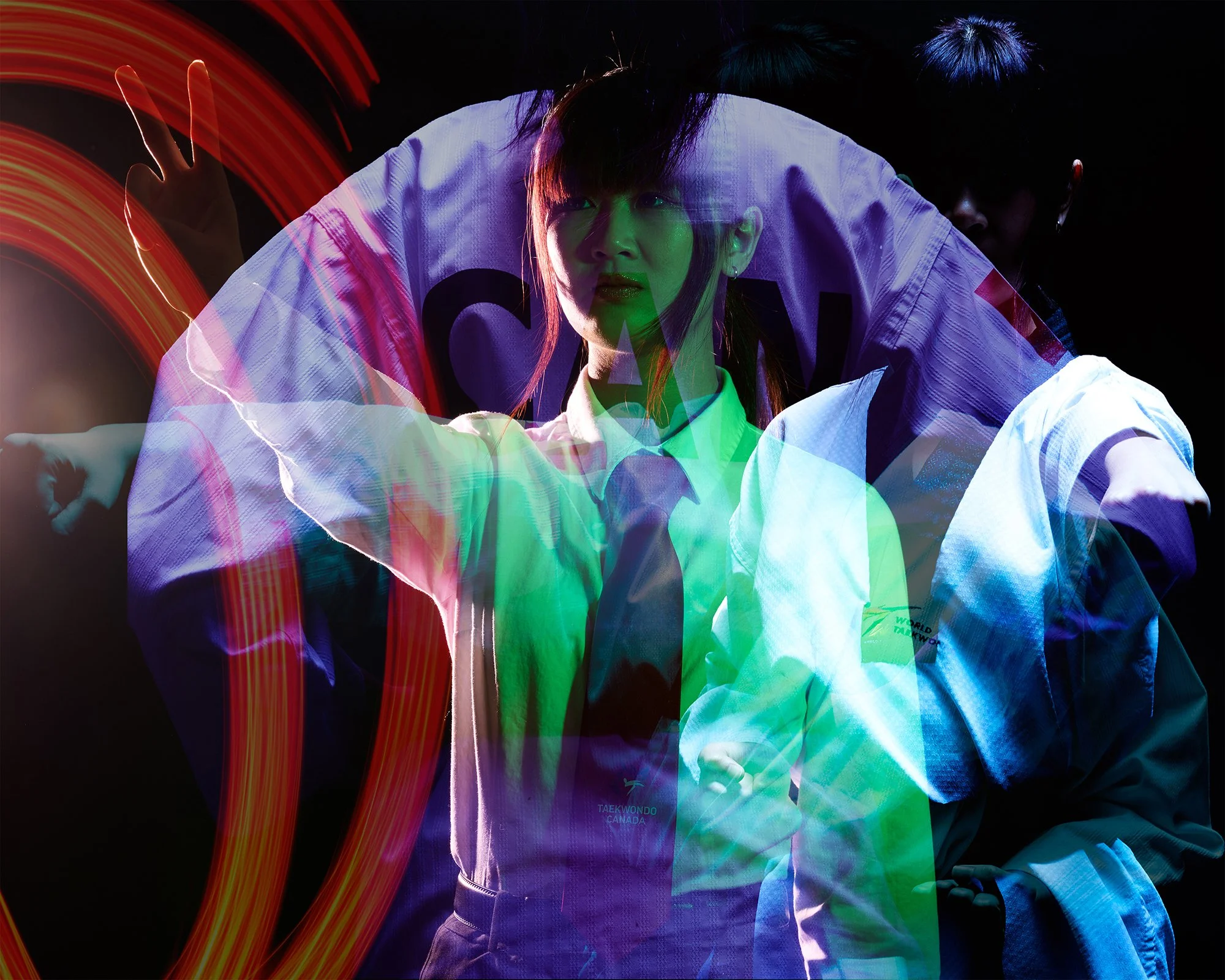 Portrait with double exposure and light painting, taekwondo practitioner in white shirt