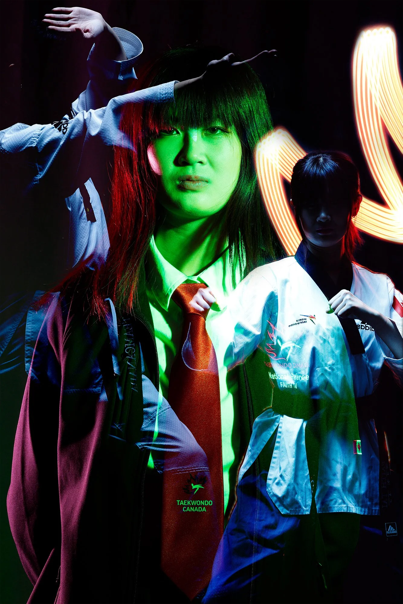 Portrait with double exposure and light painting, taekwondo practitioner wearing red tie