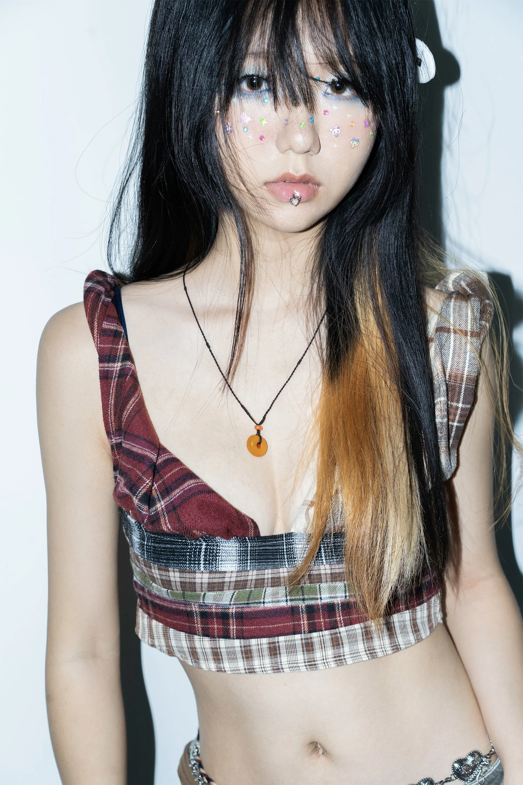 Portrait of a girl with decorative stickers on her face