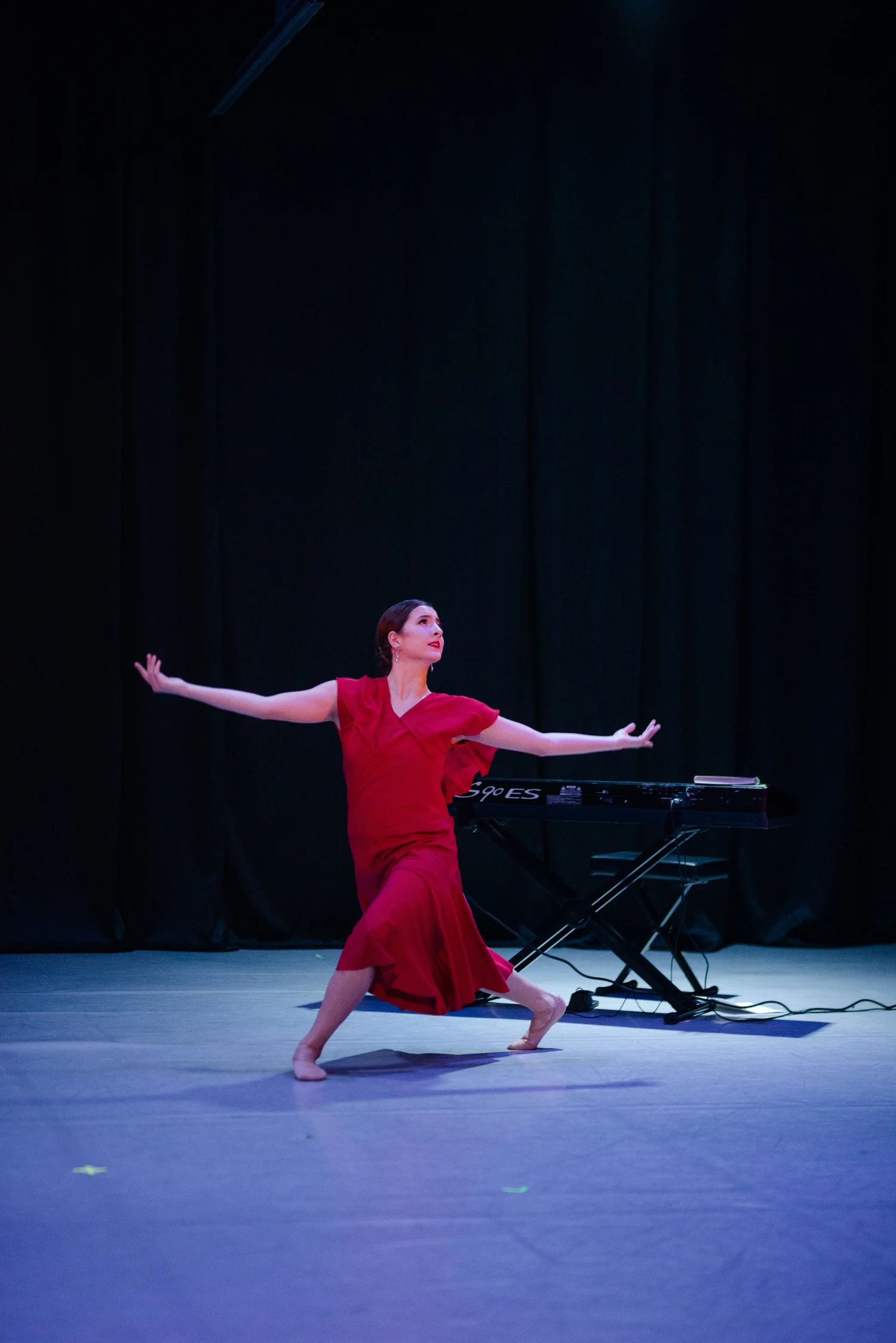 Ballet 5:8 dancer performing near a piano