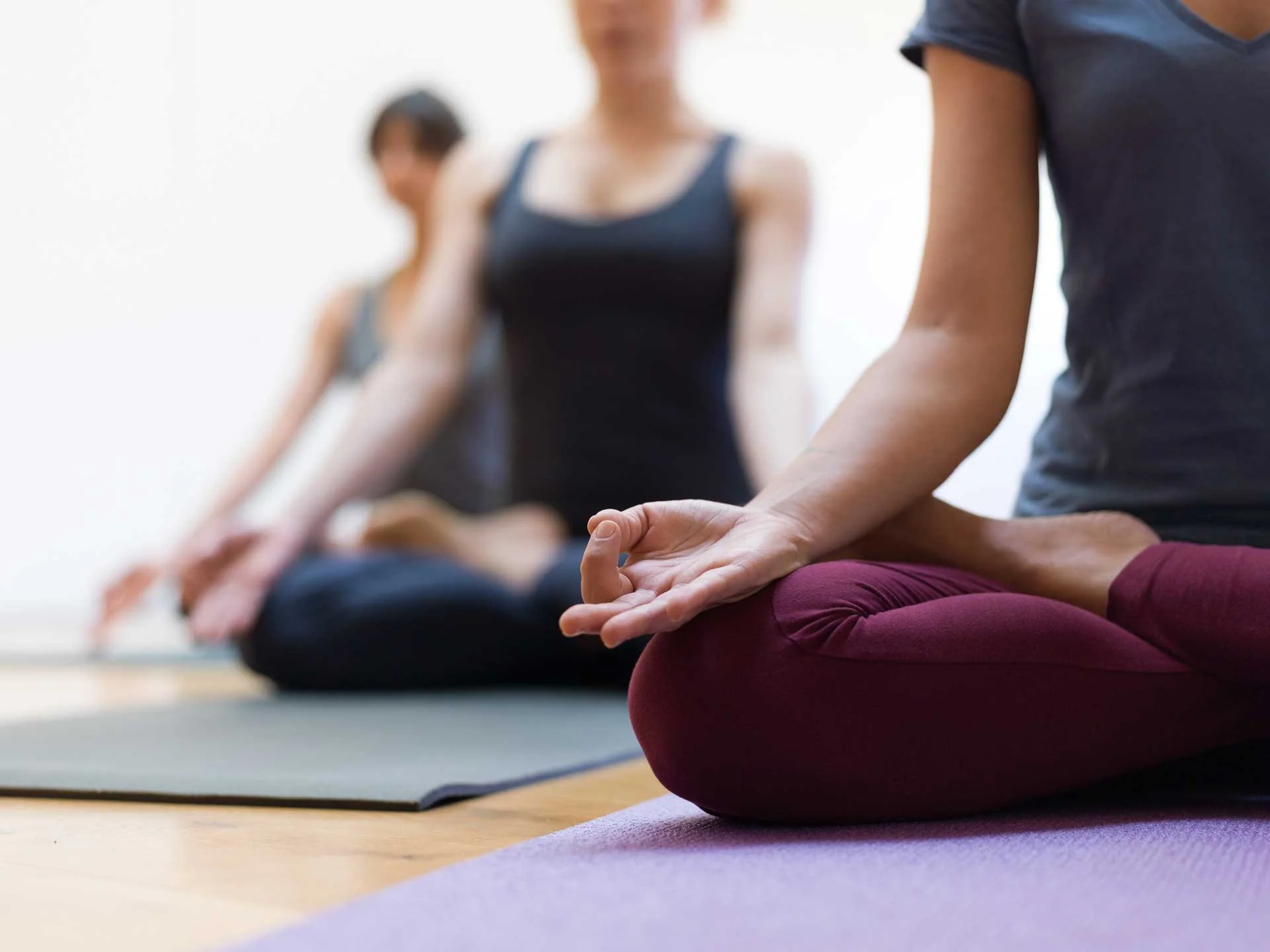 Women meditating in a class at Restore Studio in Annapolis, MD