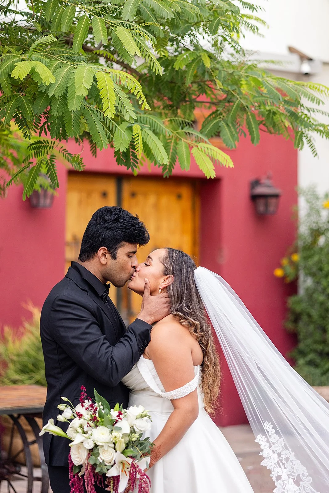 bride and groom kissing