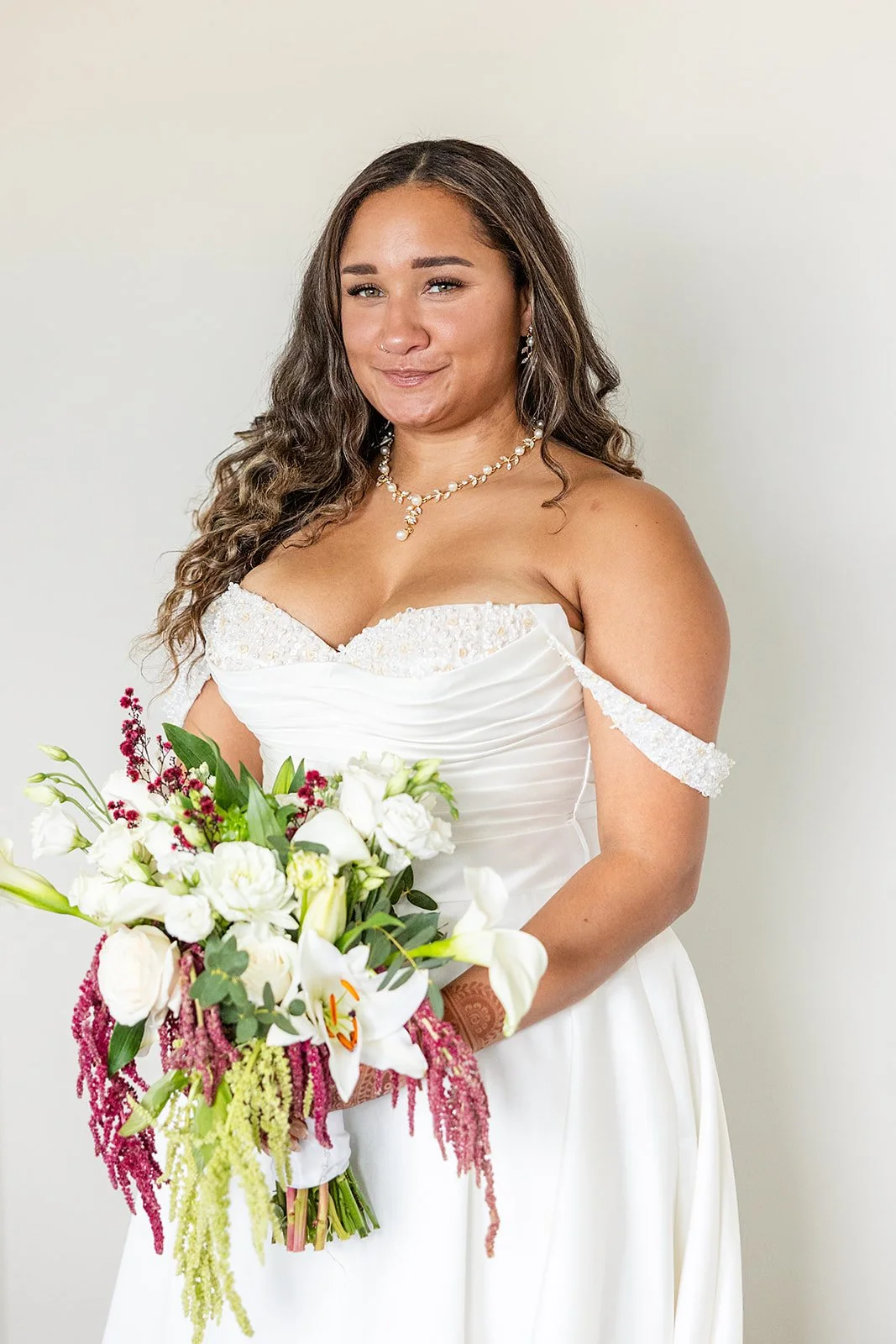 the bride standing with her flowers