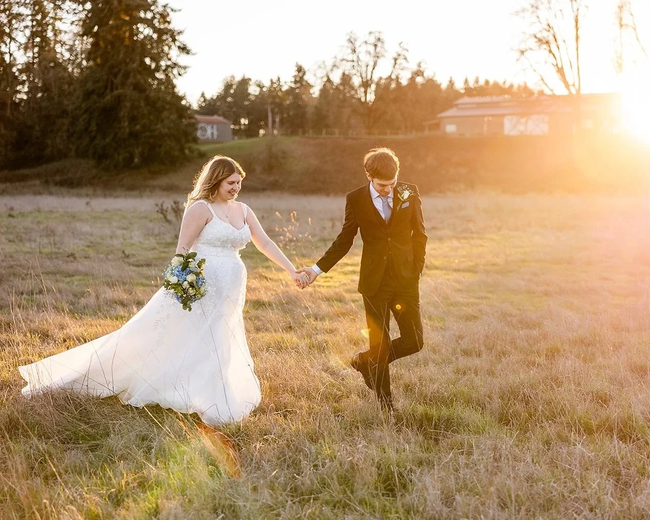bride and groom walking during sunset