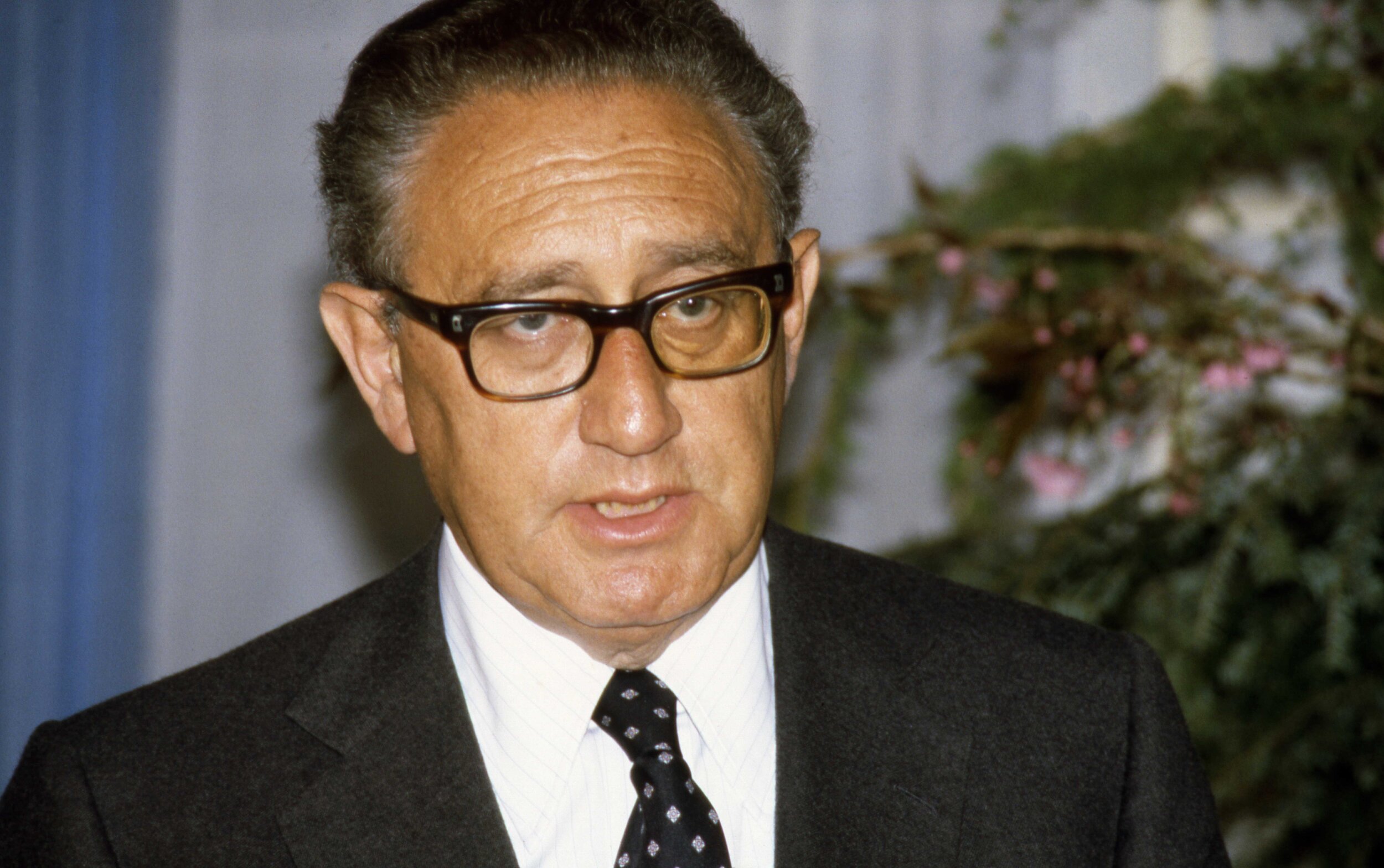 Henry Kissinger at a news conference in London