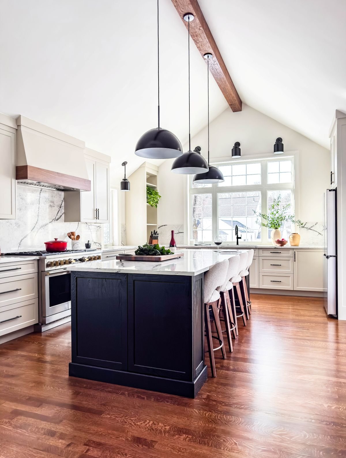 The new vaulted kitchen filled with natural light and refined architectural finishes