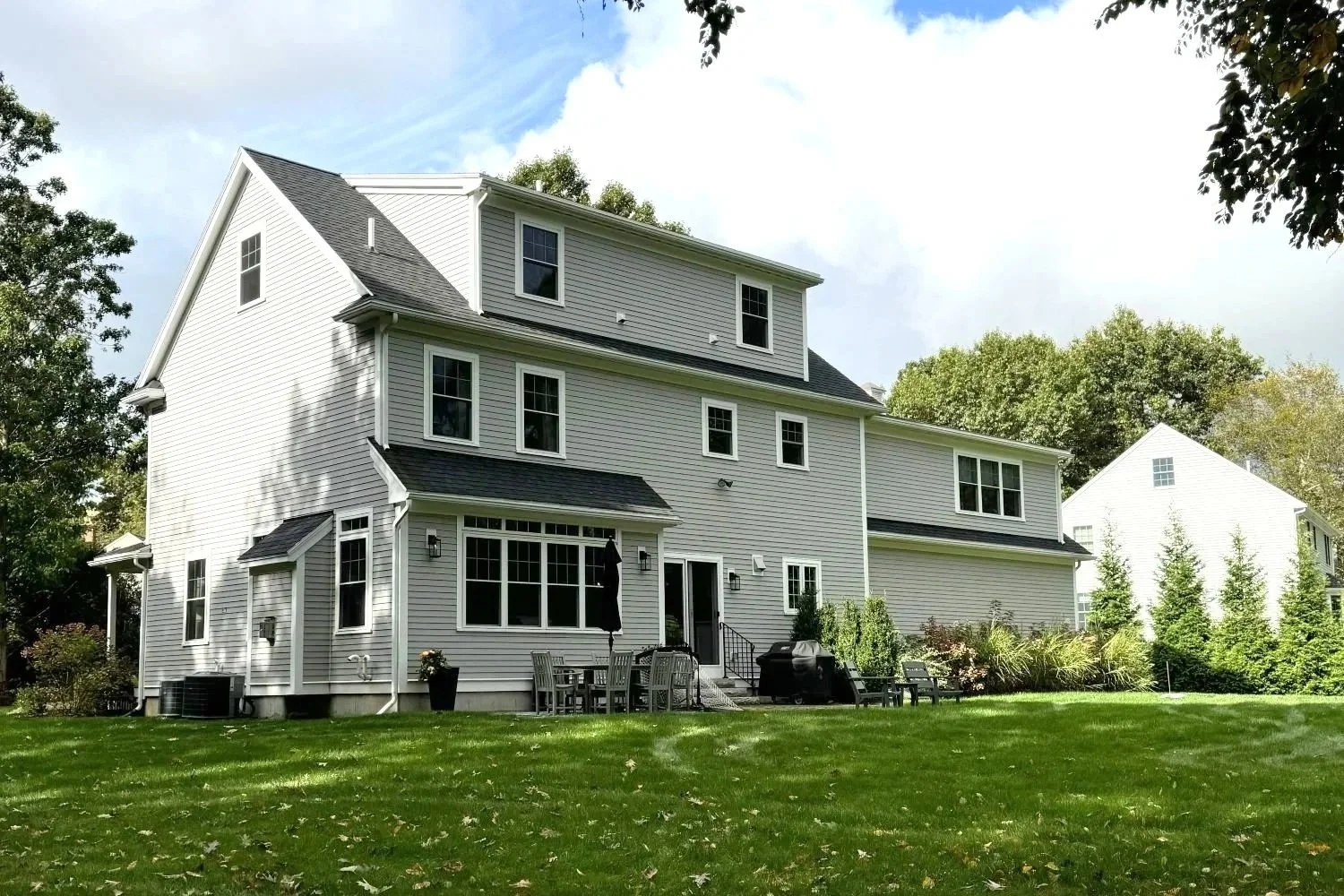 Existing angled view of a Hamilton home's rear facade depicting limited outdoor connection.