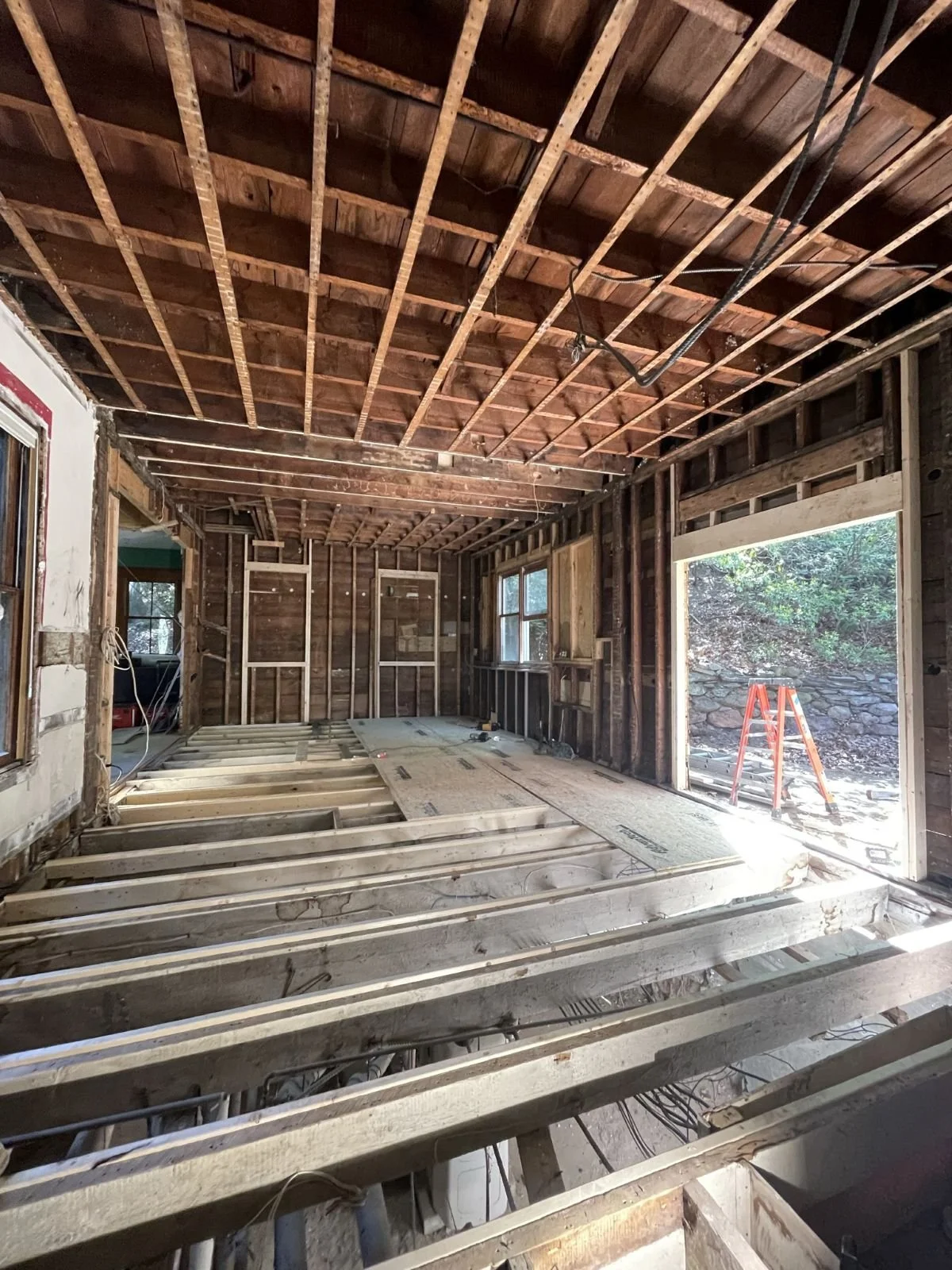 View of sistering existing floor joists to level out historic home's framing
