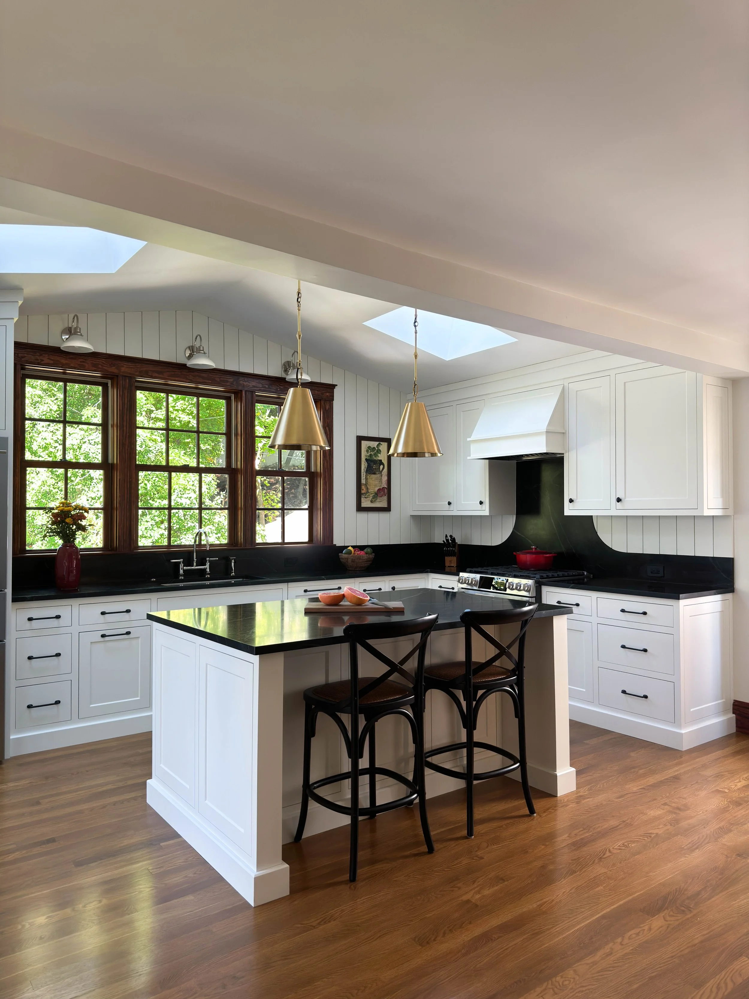 Architectural view of a 1910 kitchen addition in Medford, MA, showing the seamless integration of modern functionality and historic character.